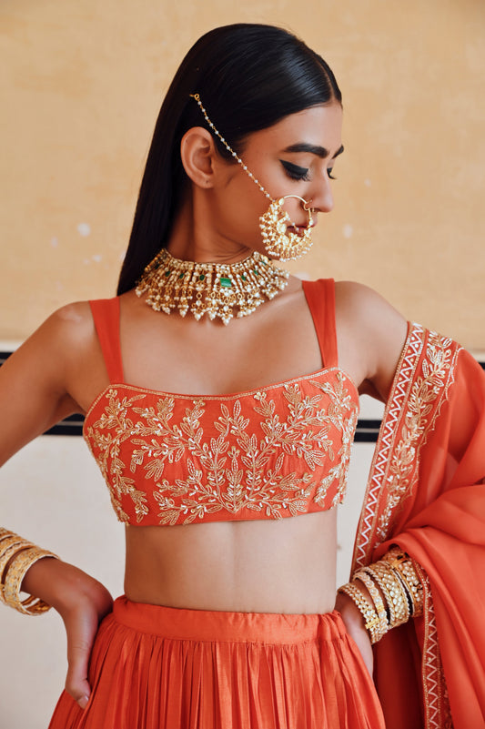 ORANGE BROAD STEP EMBROIDERED BLOUSE WITH BUTTI EMBROIDERED LEHENGA AND DUPATTA