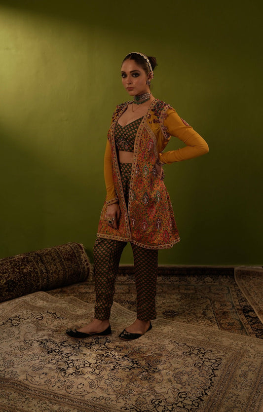 Green pants with blouse and mustard yellow jamawar jacket