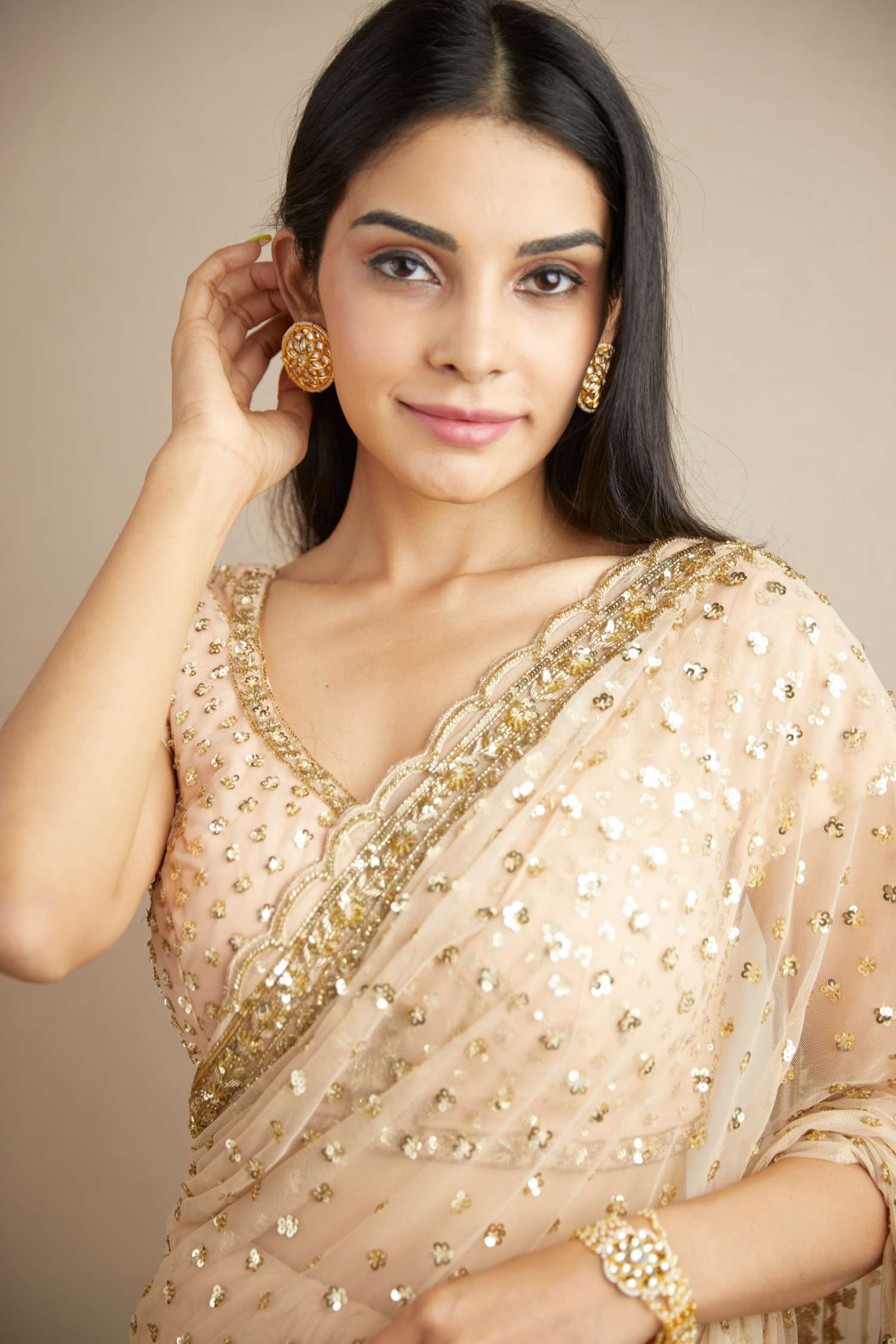 Close-up of Peach Pink Heavy Shimmer Work Saree Set