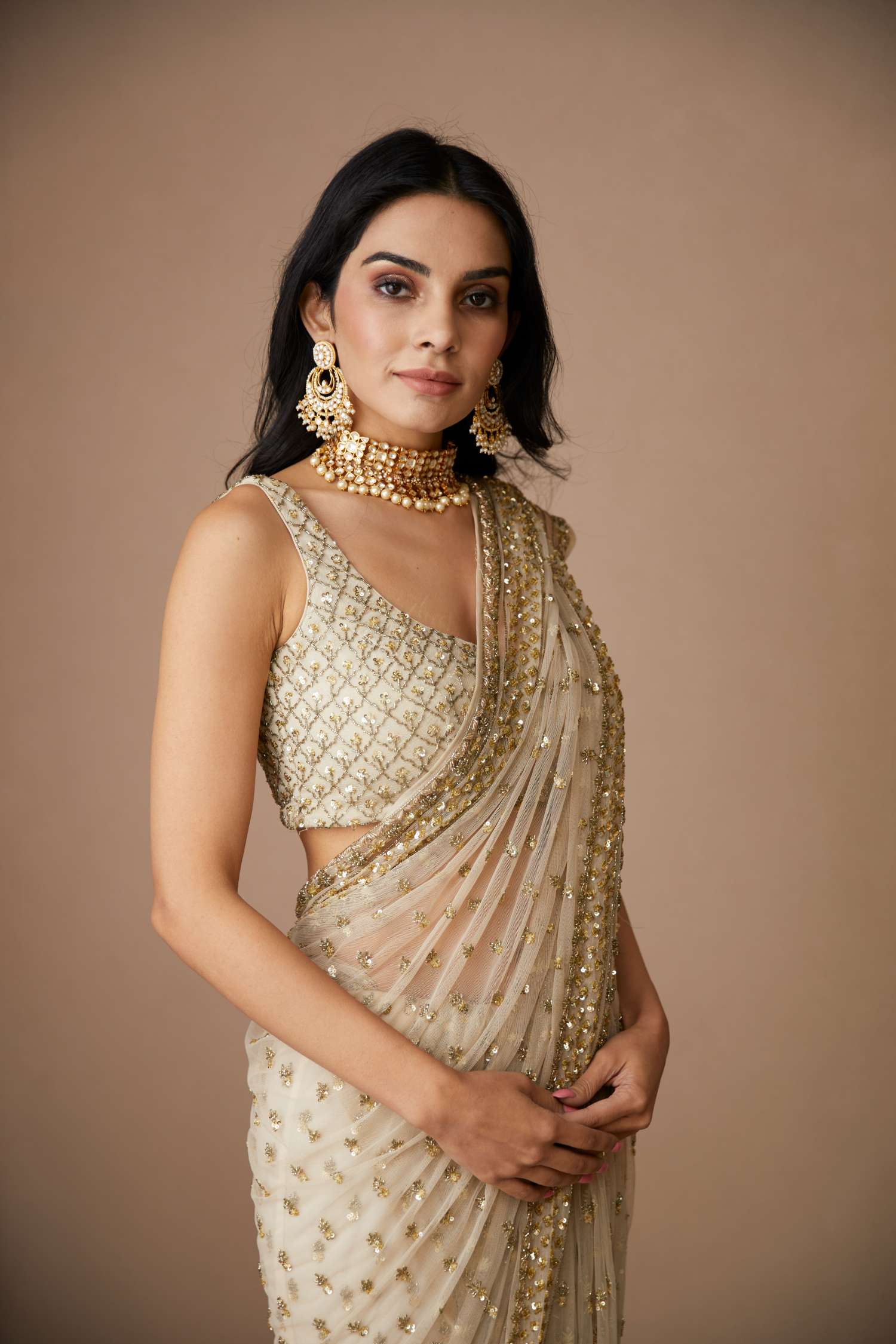 Close-up of Off White Net Bottie Saree Set
