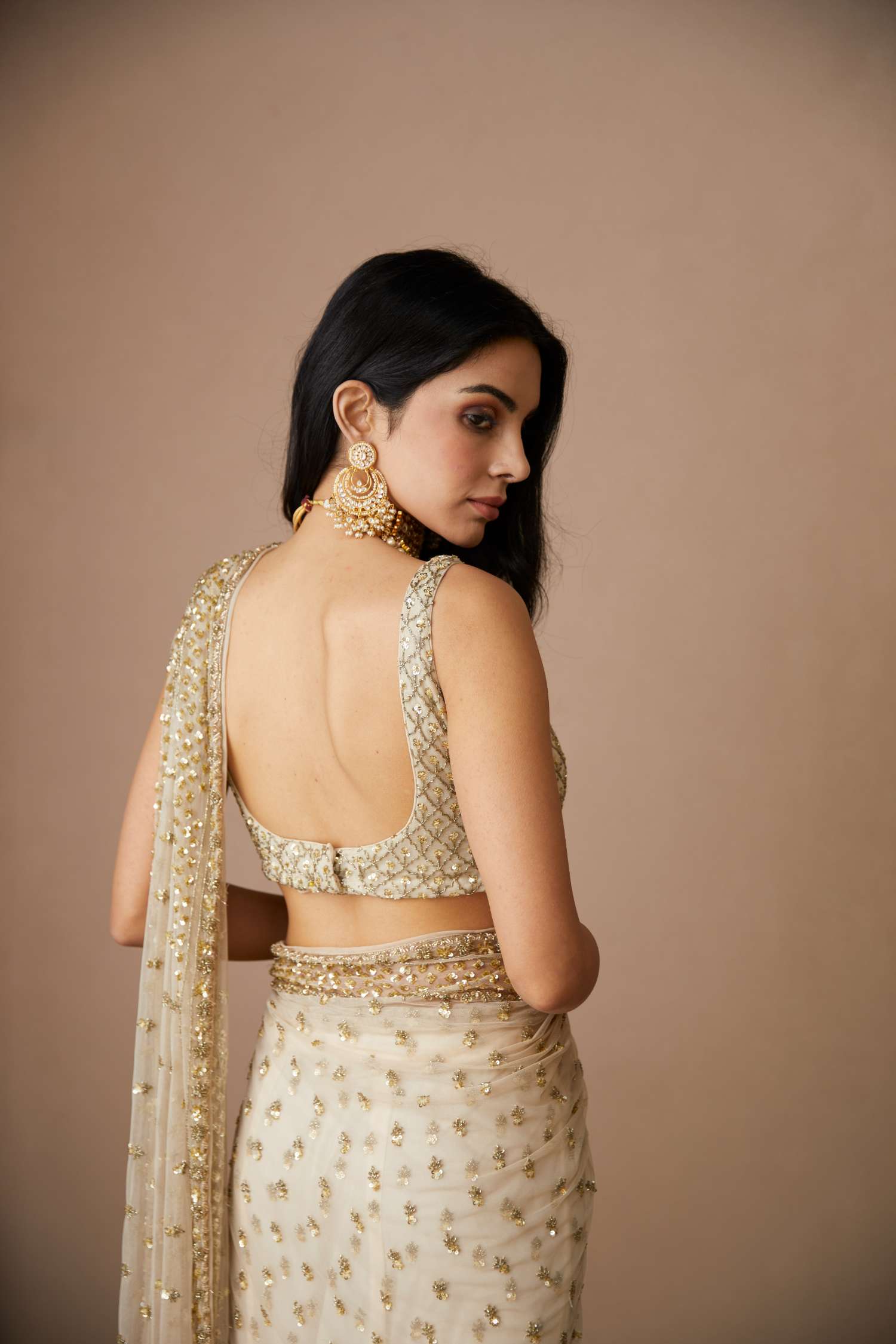 Back Angle view of Off White Net Bottie Saree Set