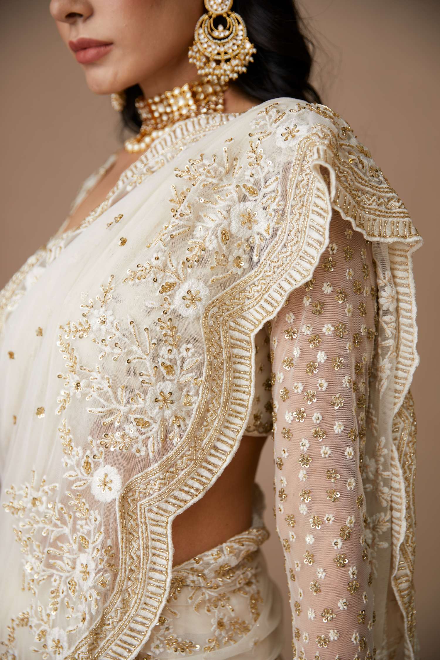 Close-up of White Net Thread Work Saree Set