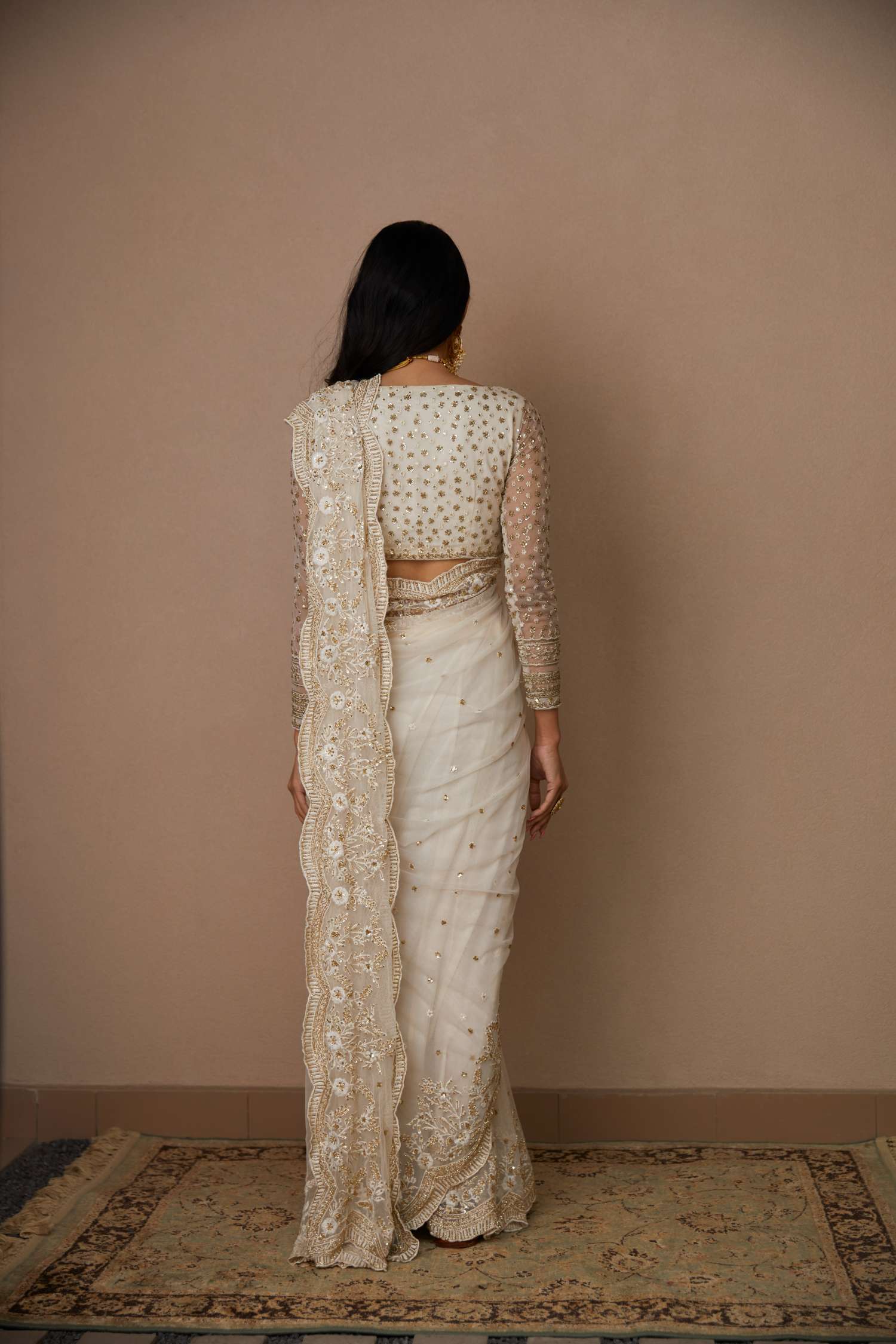 Back Angle view of White Net Thread Work Saree Set
