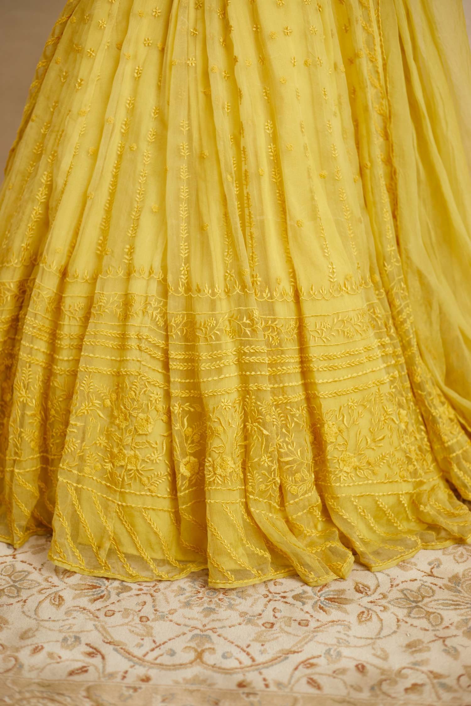 Close-up of Yellow Thread Work Lehenga Set