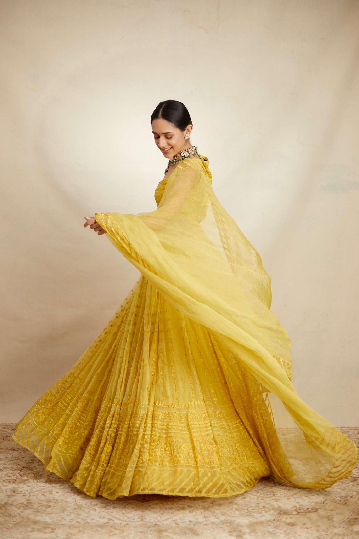 Front Side view of Yellow Thread Work Lehenga Set