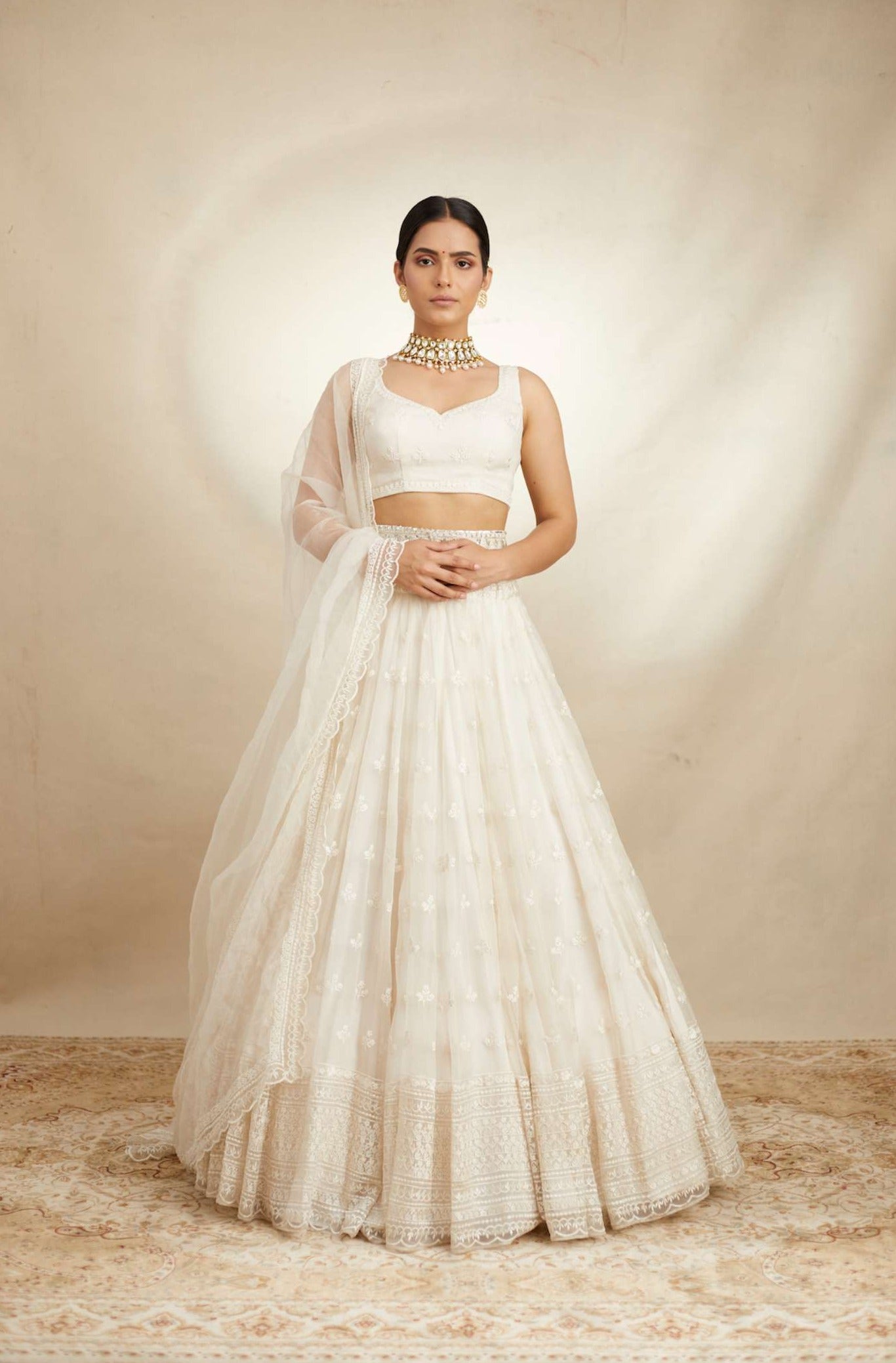 Front view of White Thread Work Lehenga Set