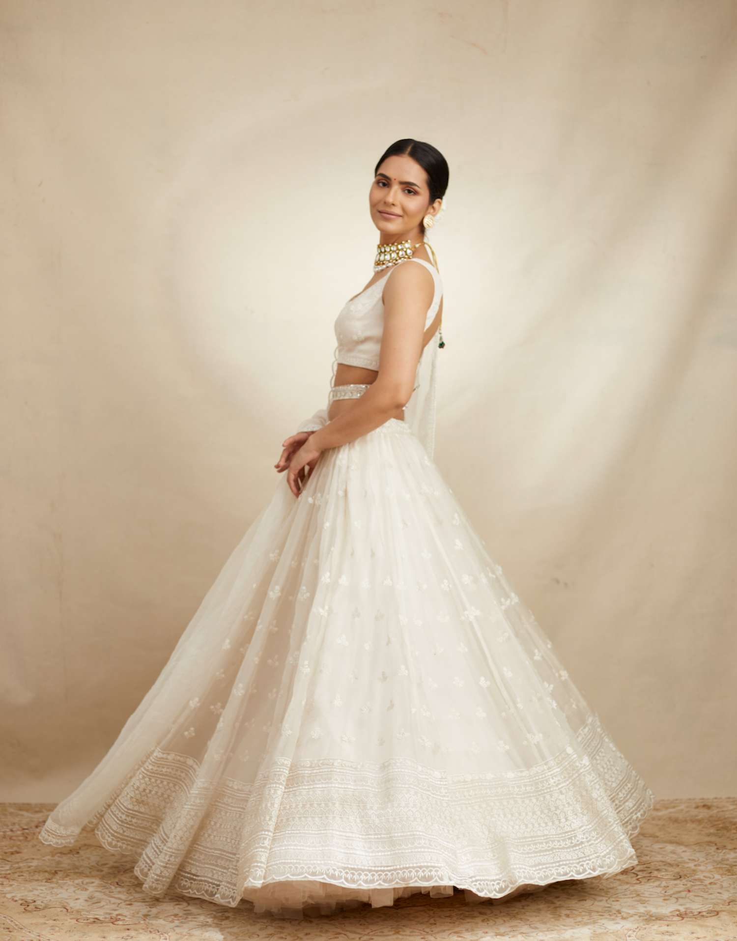 Side view of White Thread Work Lehenga Set