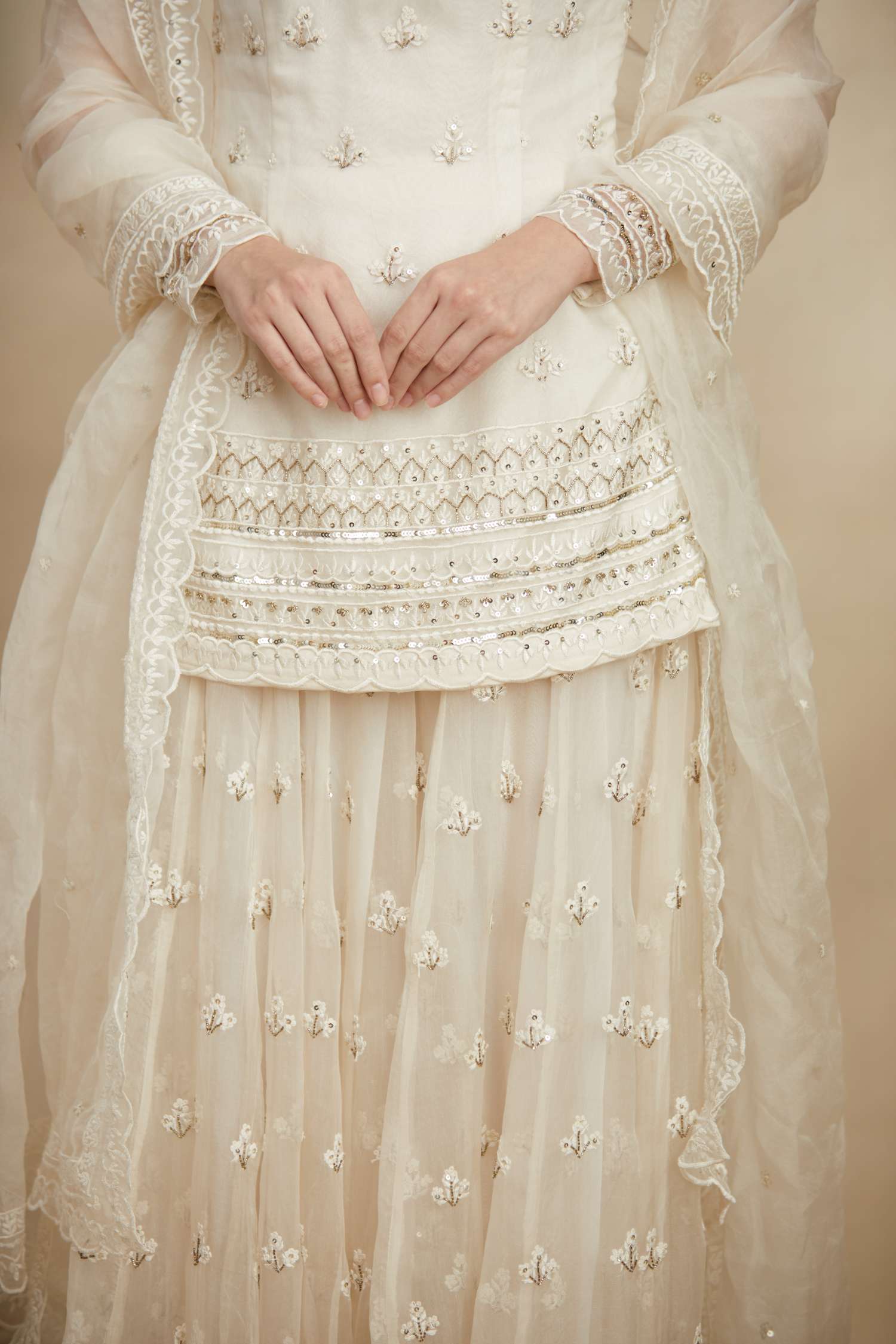 Close-up of White Thread Work Kurti Sharara Set