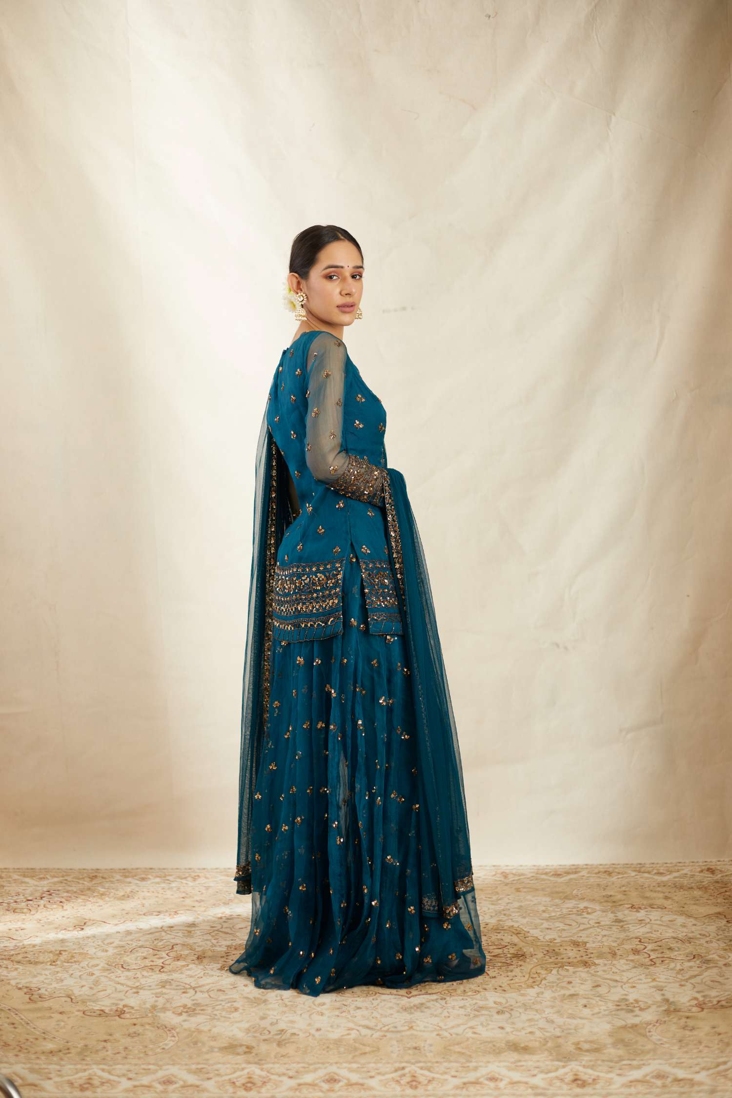 Side view of Teal Blue Organza Sequence Work Kurti Sharara Set