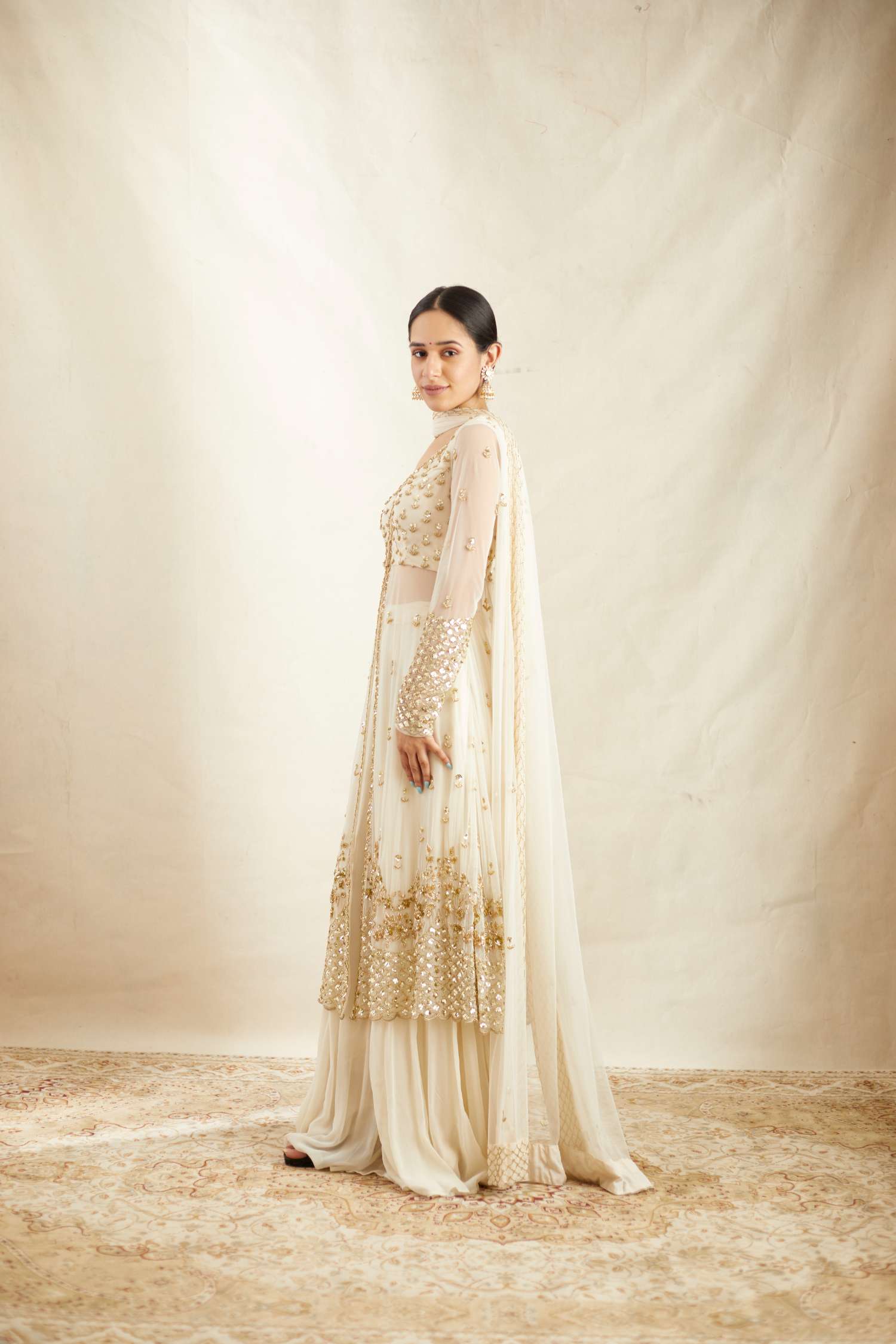 Side view of Off White Net Front Open Jacket With Sharara Set