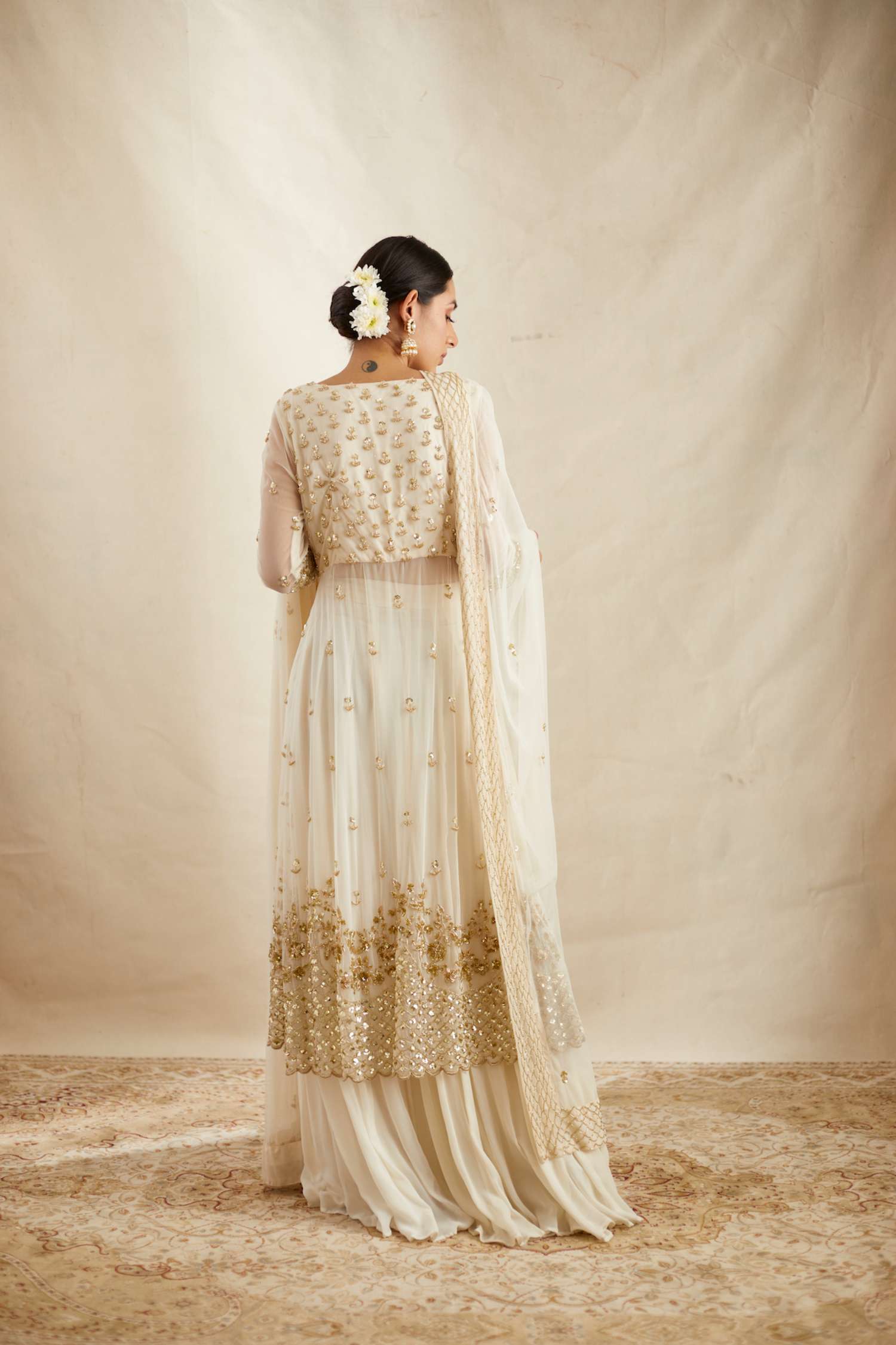 Back Angle view of Off White Net Front Open Jacket With Sharara Set