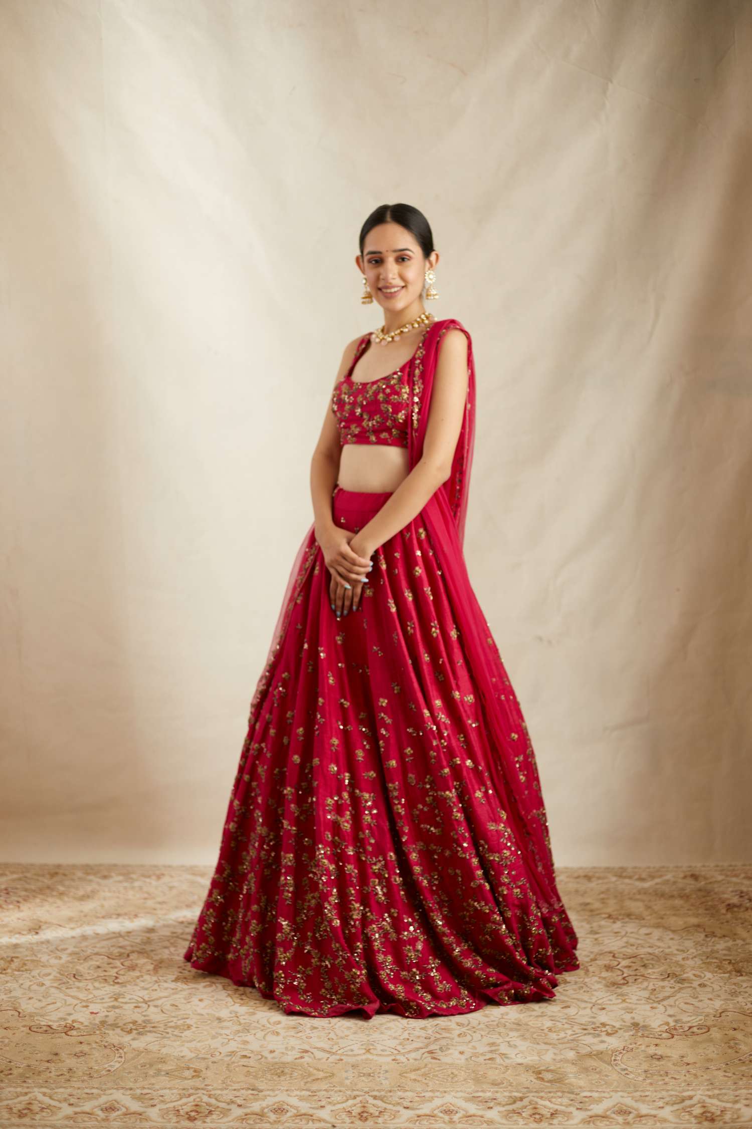 Front view of Caramine Pink Embellished Lehenga Set