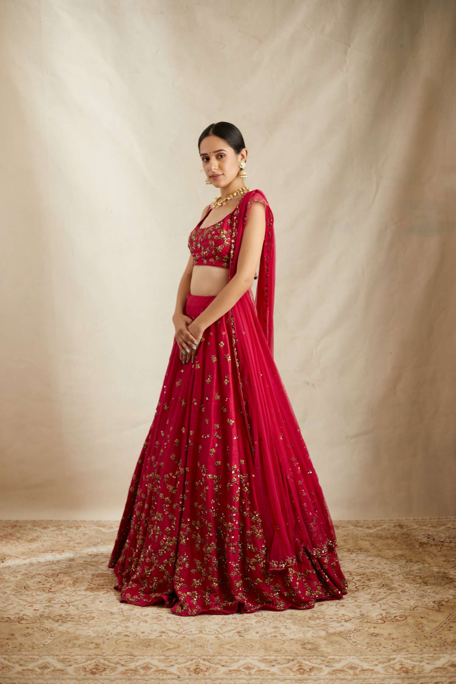 Side Front view of Caramine Pink Embellished Lehenga Set