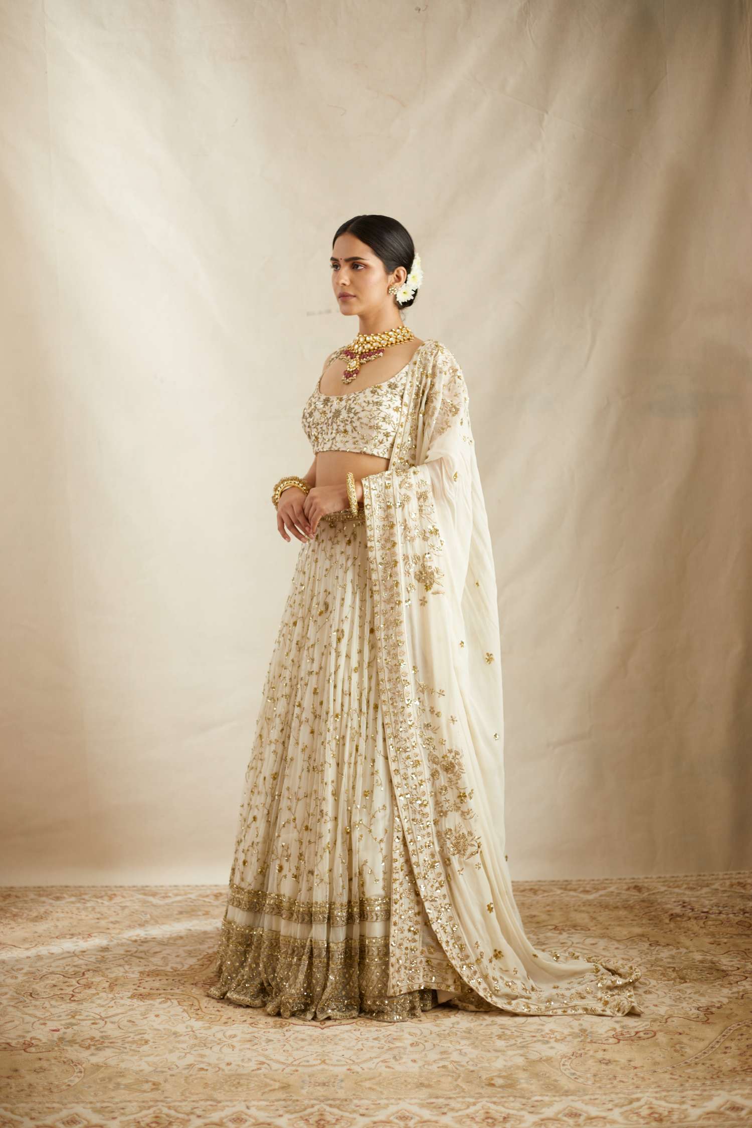 Side Front view of Off White Heavy Jaal Work Lehenga Set