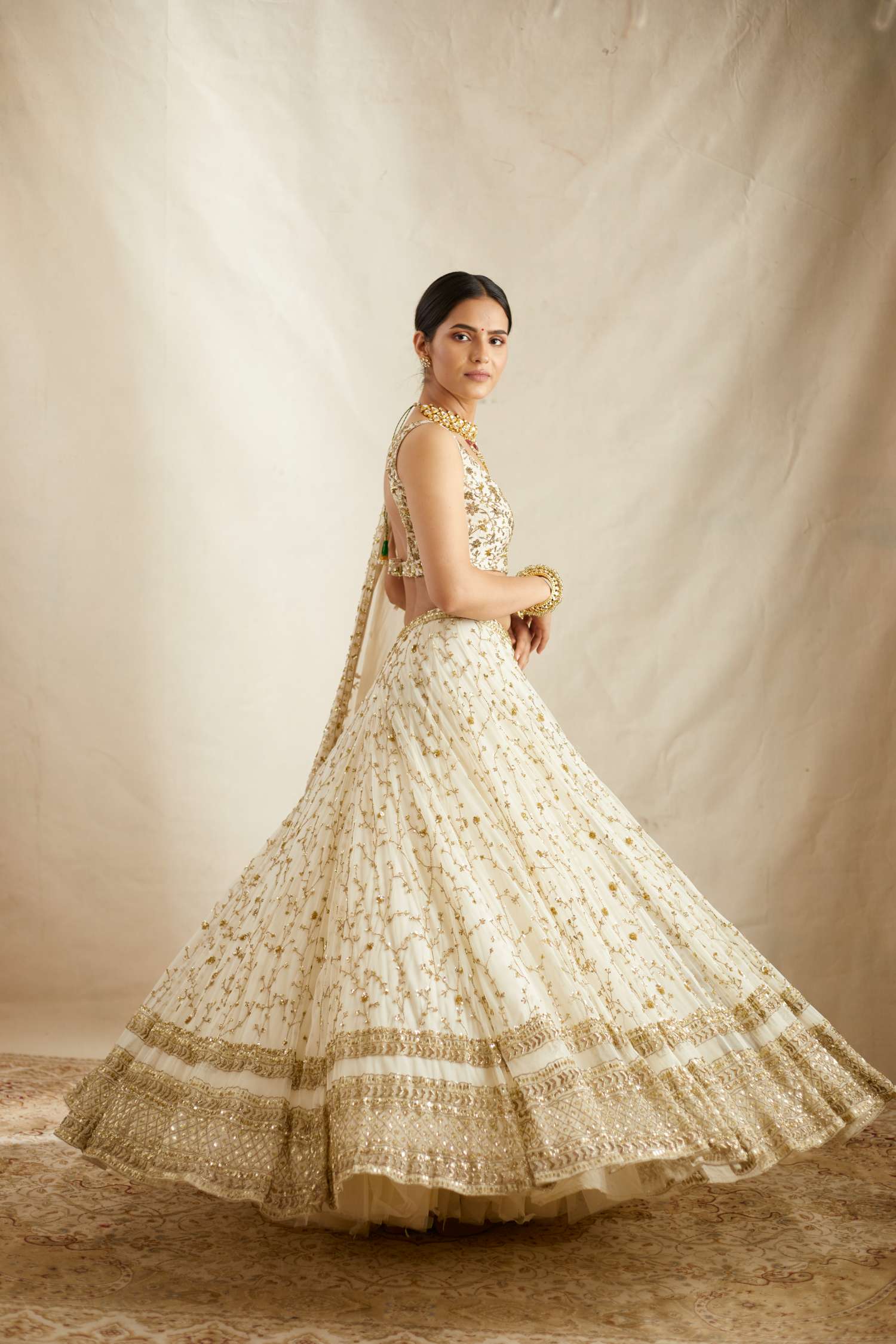 Side view of Off White Heavy Jaal Work Lehenga Set