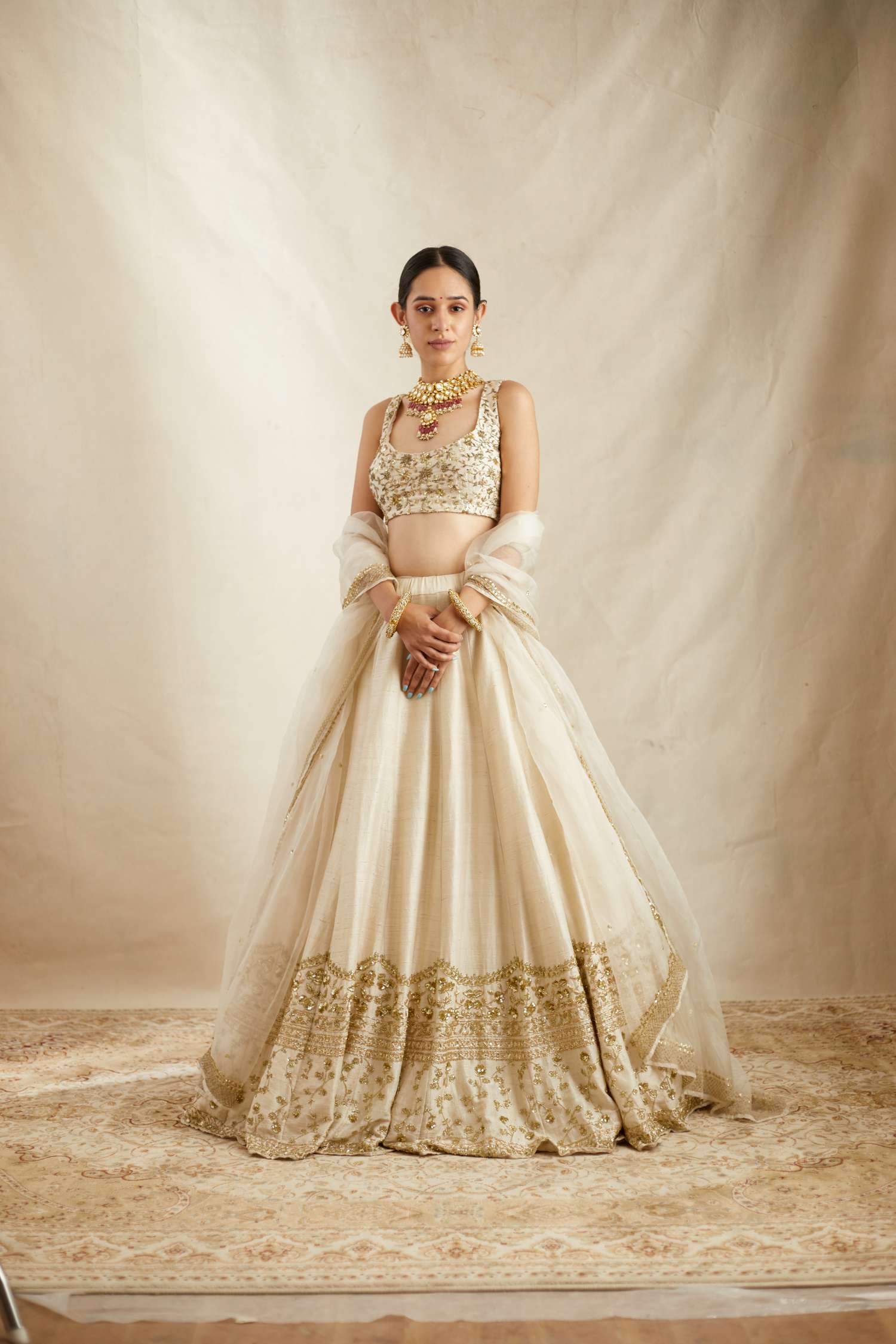 Front view of Off White Gold Work Raw Silk Lehenga Set for Women