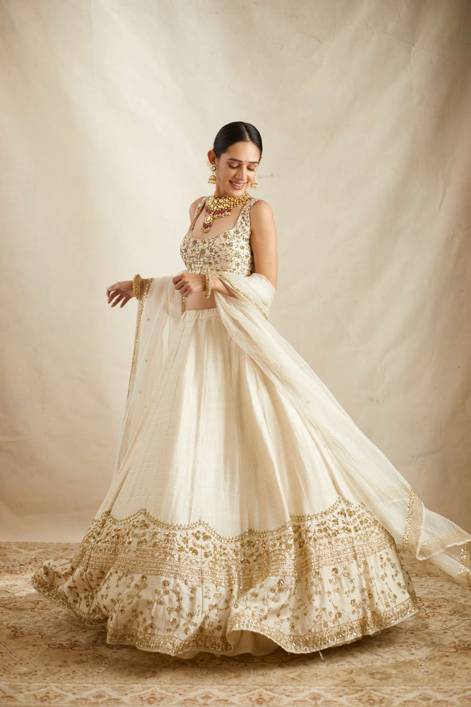 Side view of Off White Gold Work Raw Silk Lehenga Set