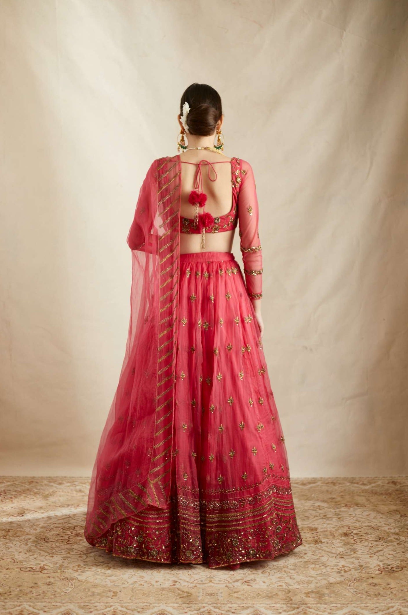 Back Angle view of Carmine Pink Silk Organza Crepe Embroidered Lehenga