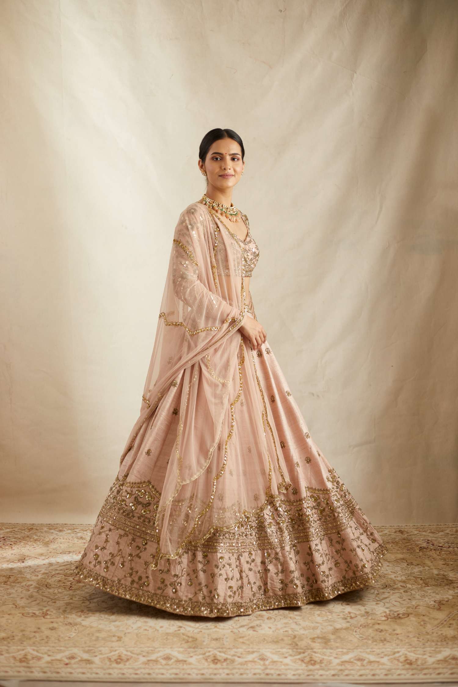 Front Side view of Peach Pink Embroidered Raw Silk Lehenga Set
