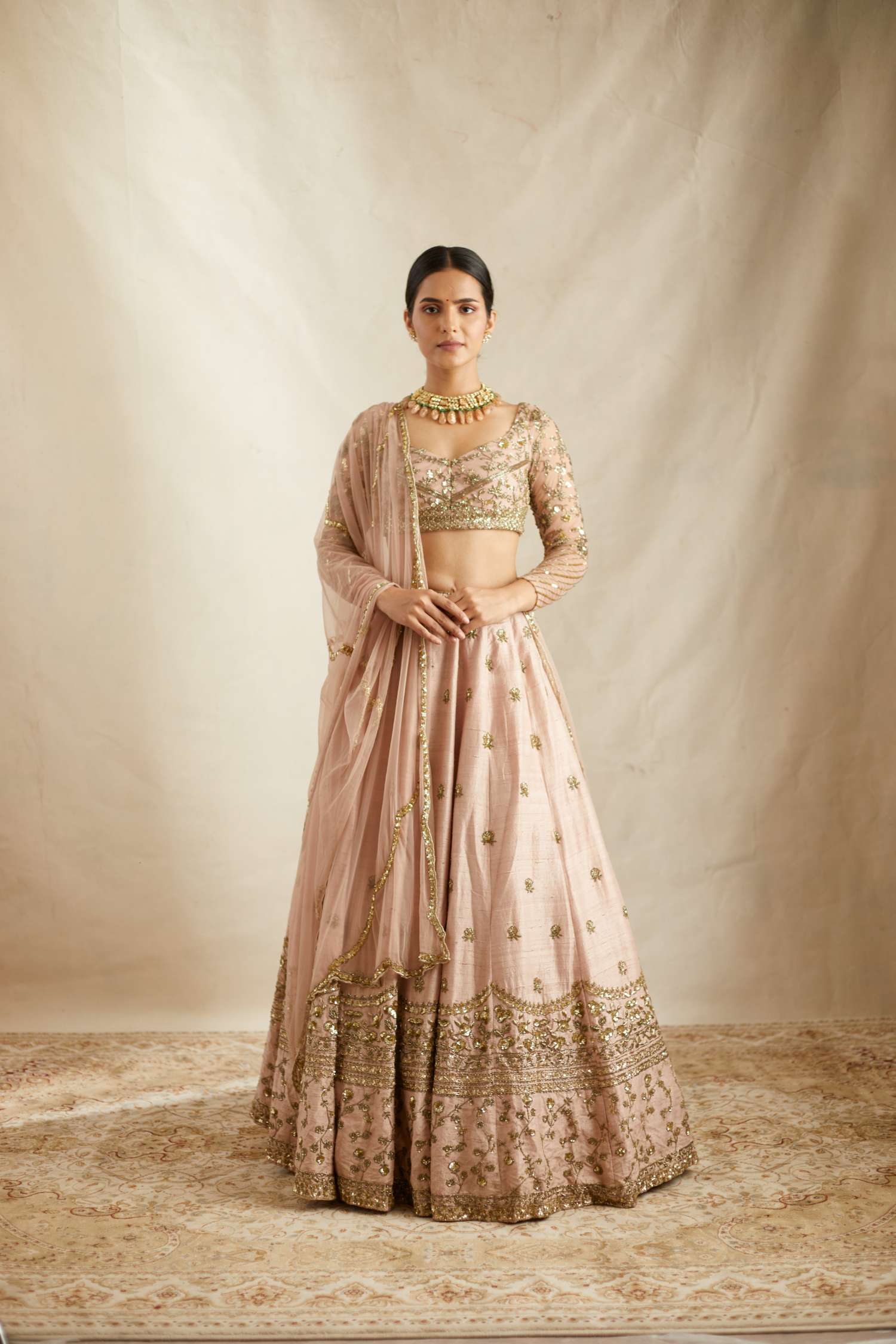 Front view of Peach Pink Embroidered Raw Silk Lehenga Set for Women