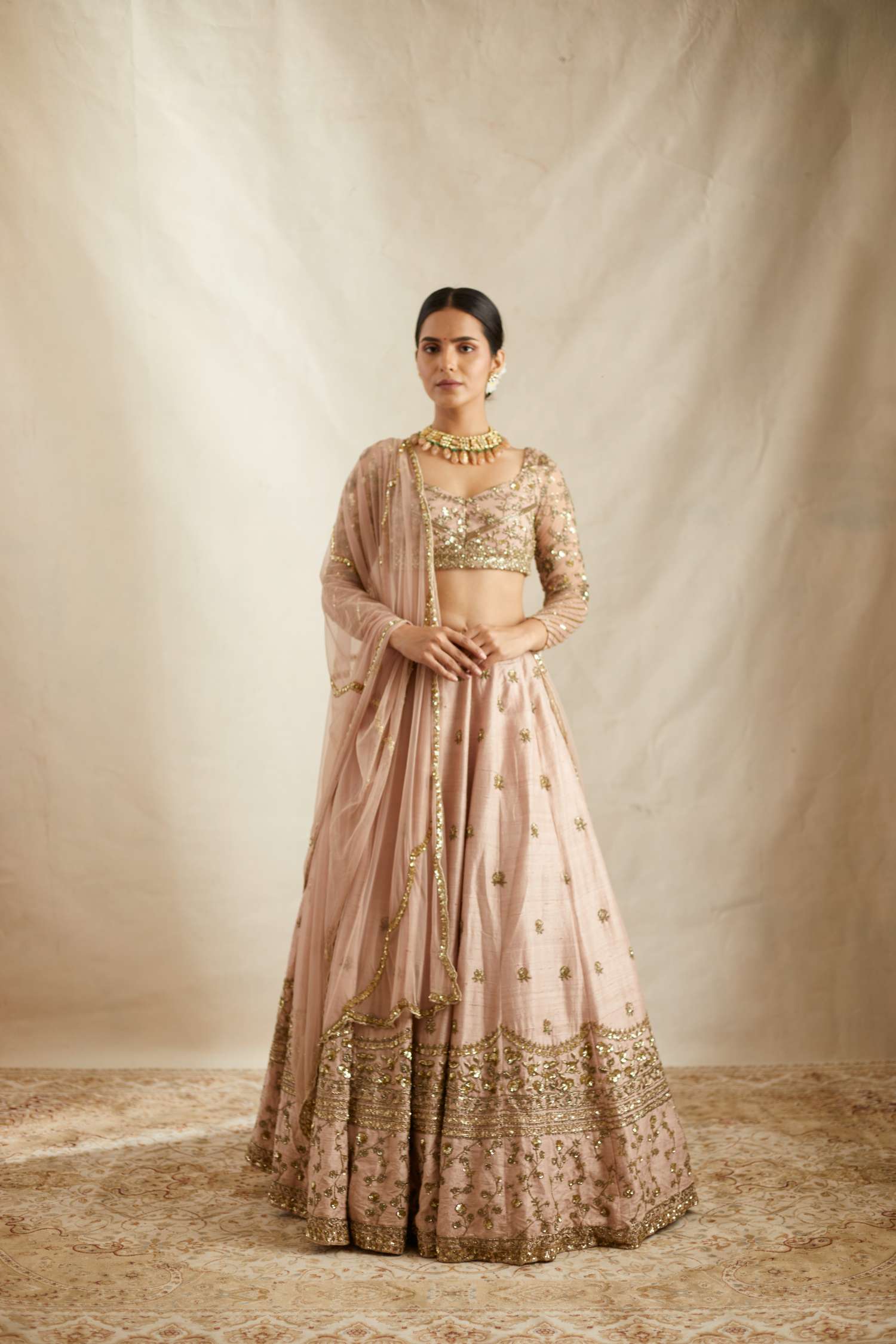 Front view of Peach Pink Embroidered Raw Silk Lehenga Set for Women