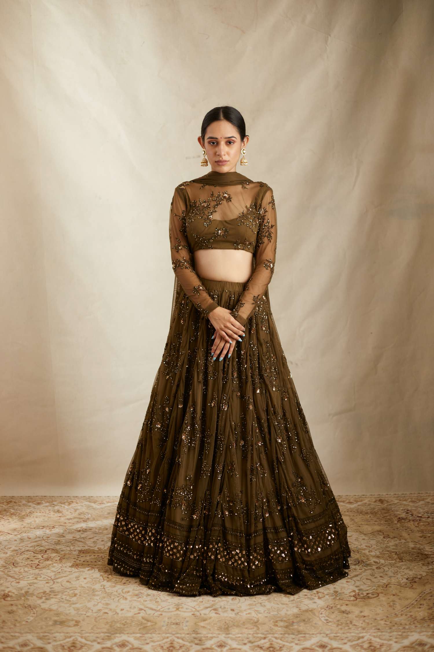 Luxurious Dark Green Net Thread Work Lehenga Set