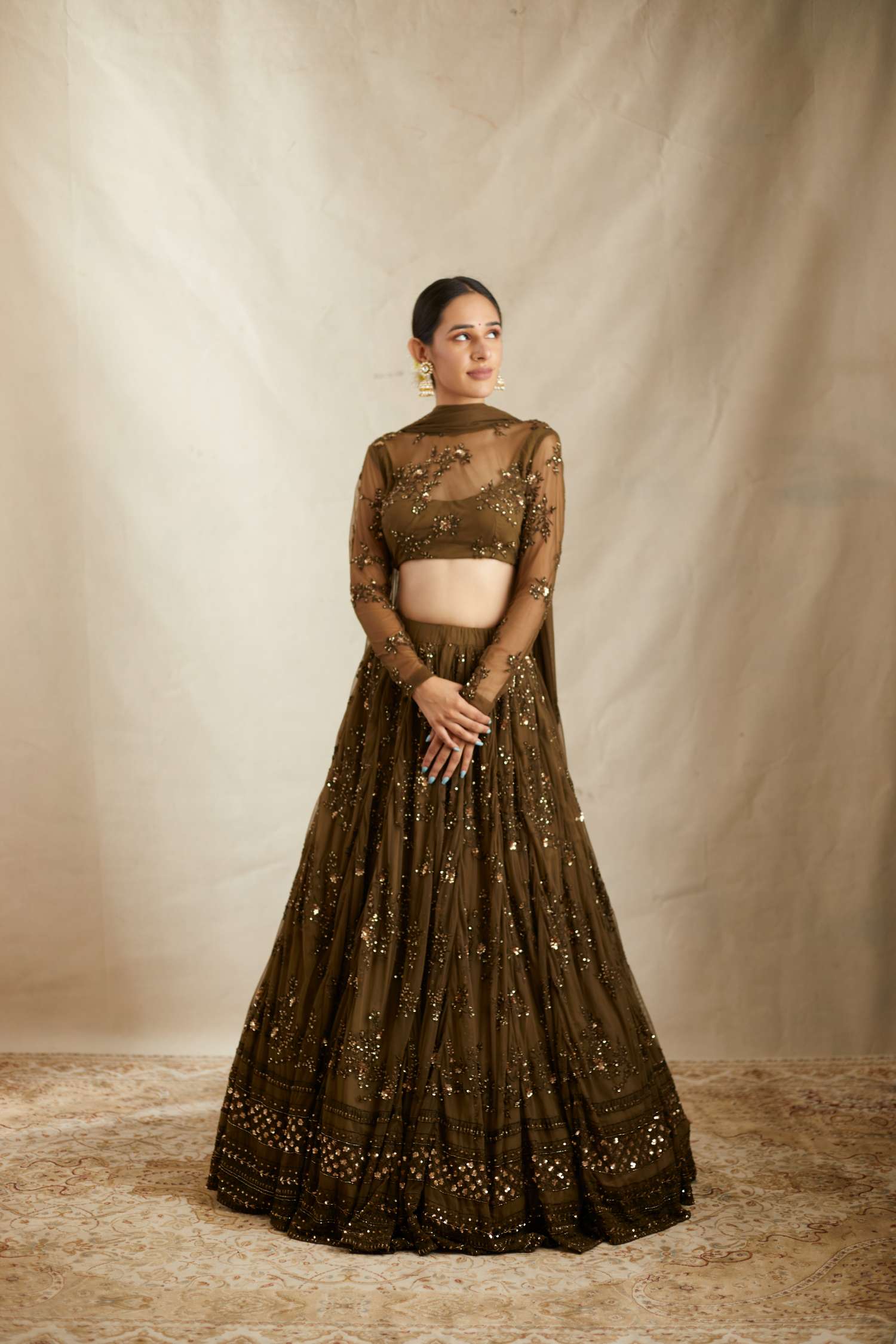 Front view of Dark Green Net Thread Work Lehenga Set