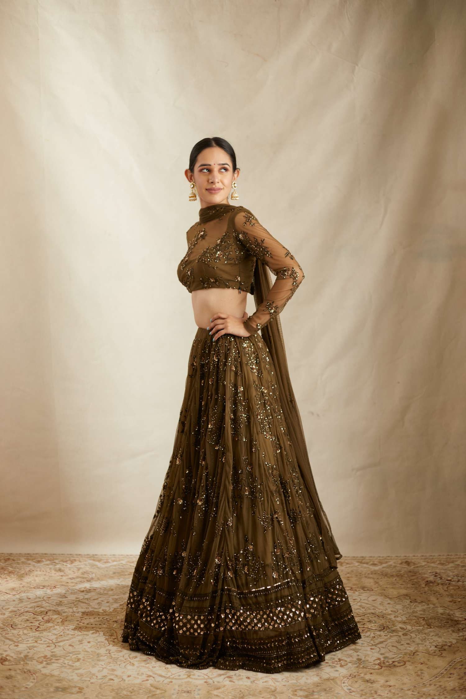 Side view of Dark Green Net Thread Work Lehenga Set