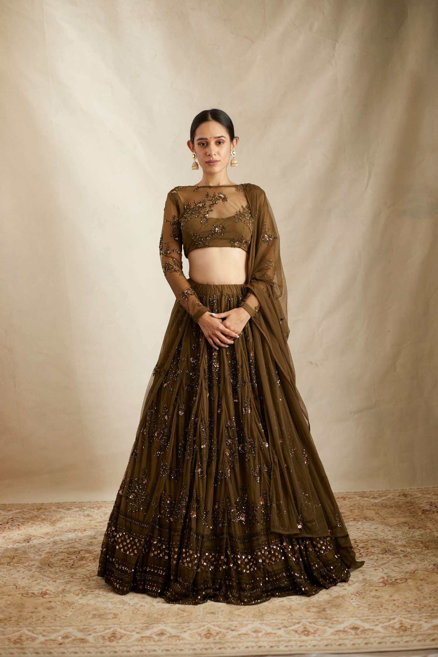 Front view of Dark Green Net Thread Work Lehenga Set