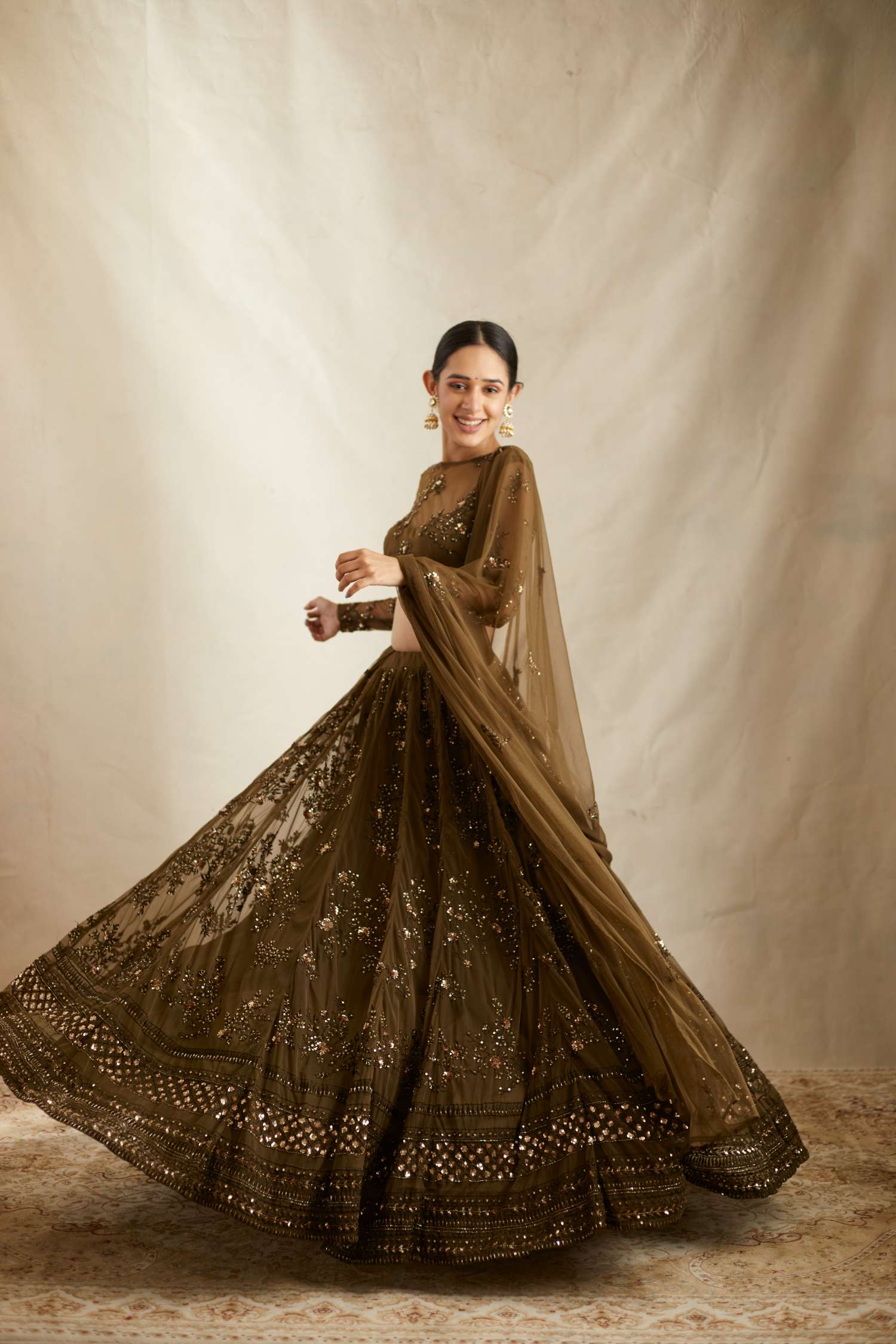 Fornt Angle view of Dark Green Net Thread Work Lehenga Set