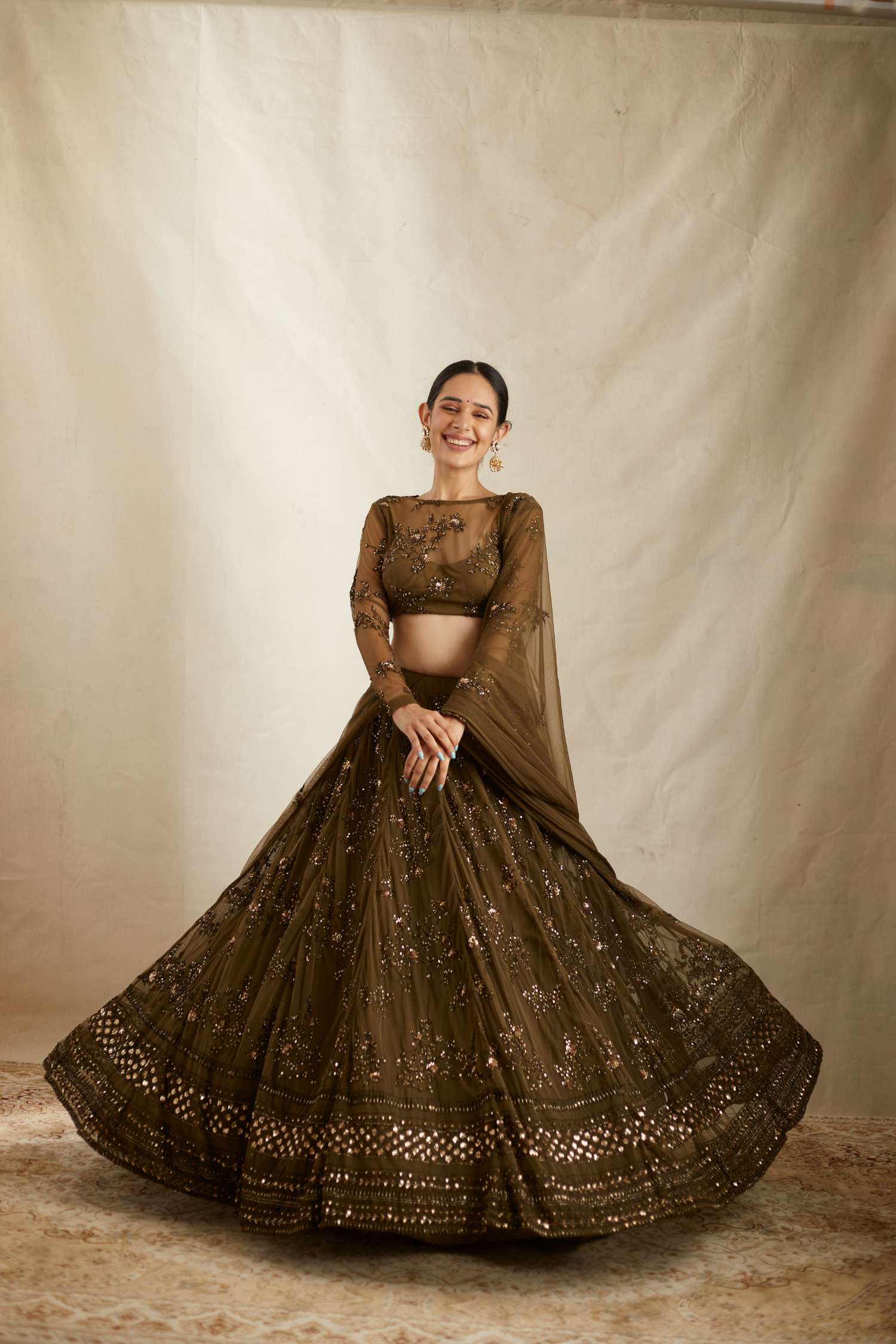 Full Front view of Dark Green Net Thread Work Lehenga Set