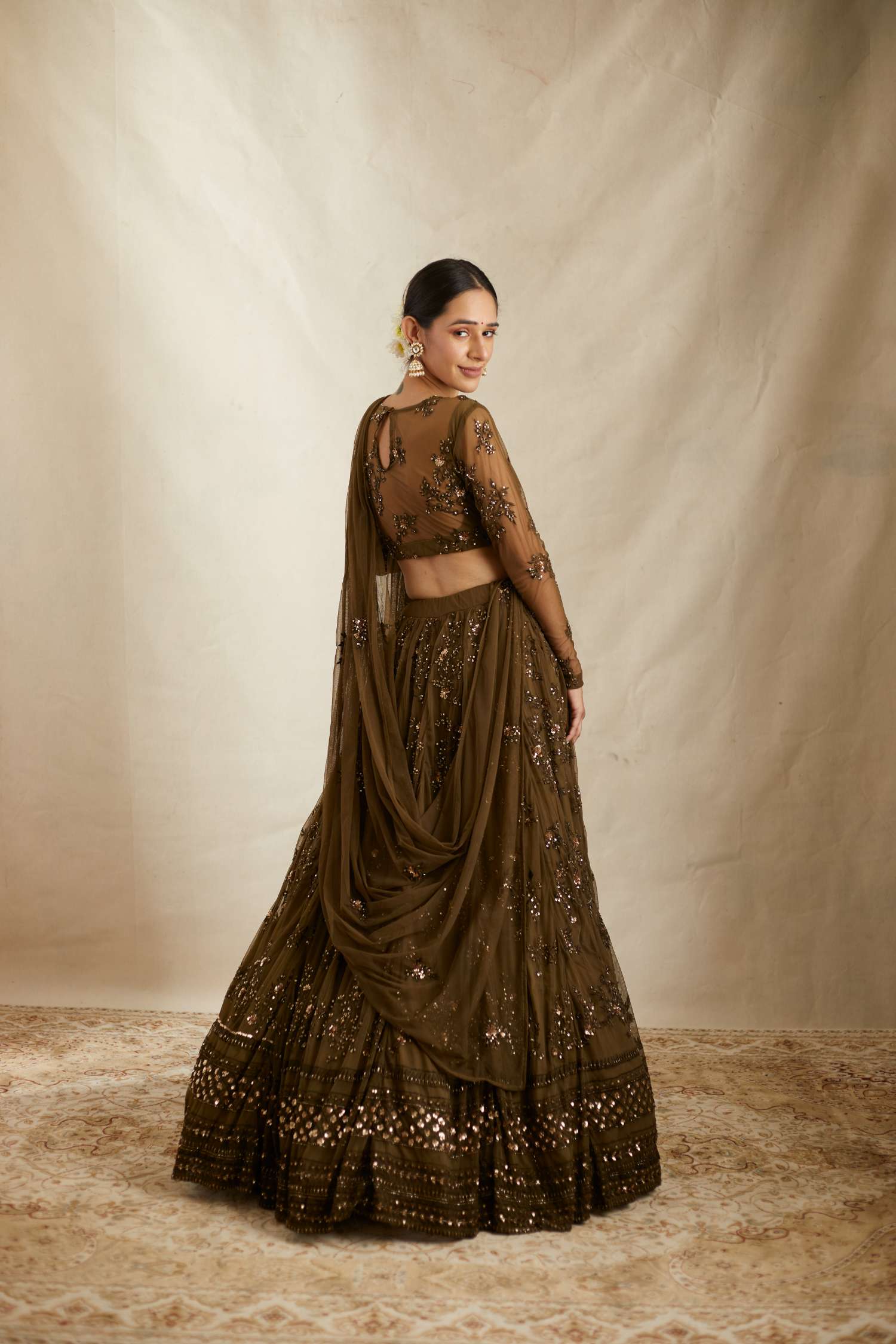 Full back view of Dark Green Net Thread Work Lehenga Set