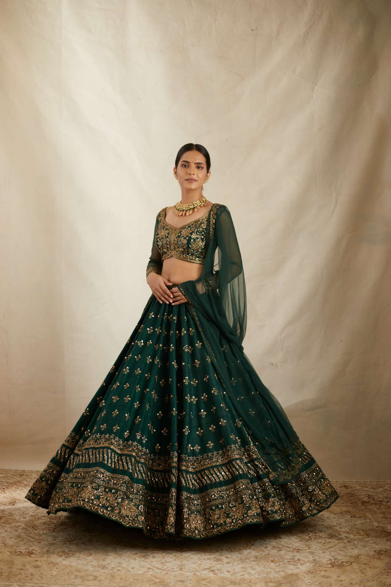 Front view of Embrelled Green Raw Silk Lehenga Set By Astha Narang
