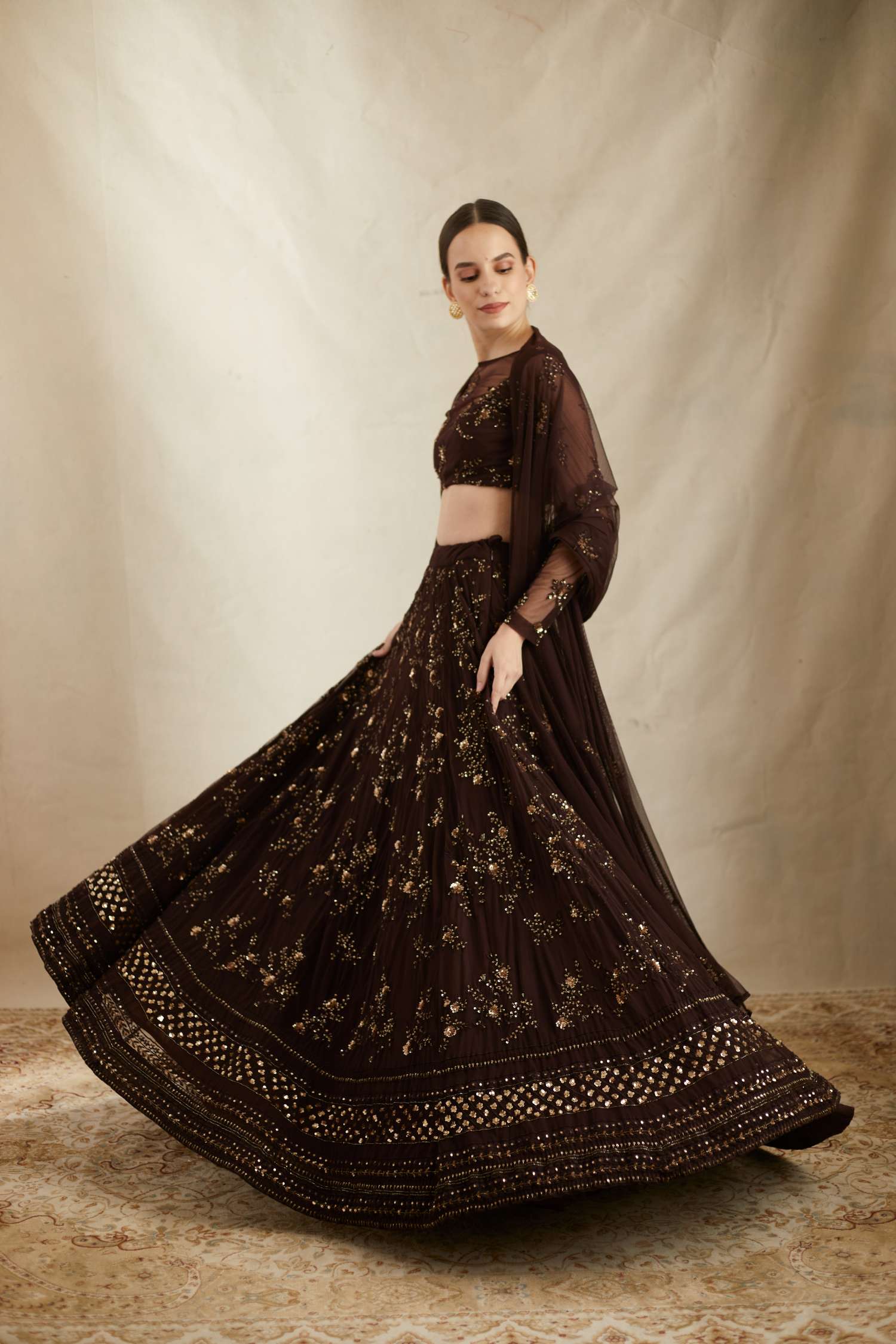 Side view of Dark Coffee Net Thread Embroidered Lehenga Set