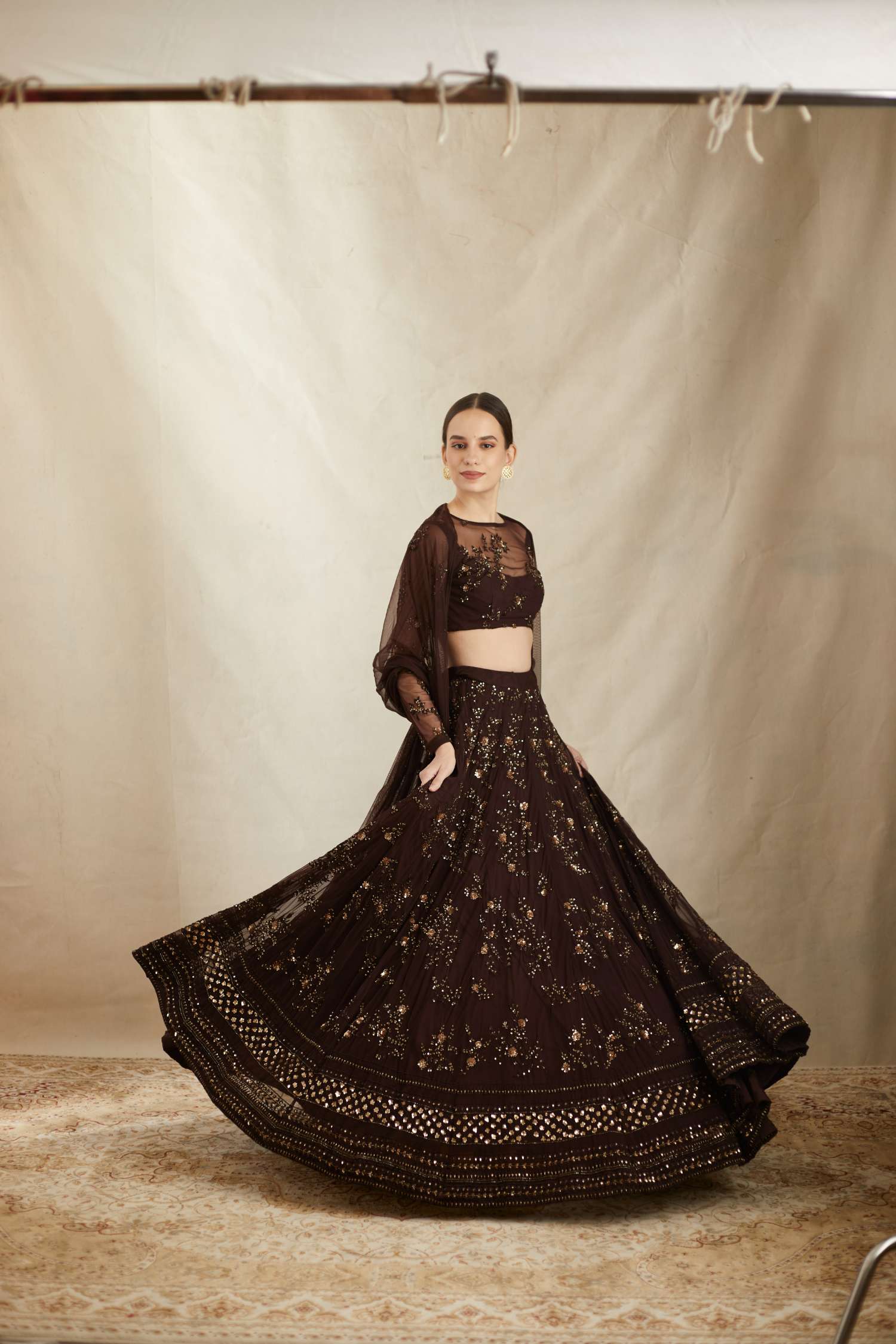 Front Side view of Dark Coffee Net Thread Embroidered Lehenga Set