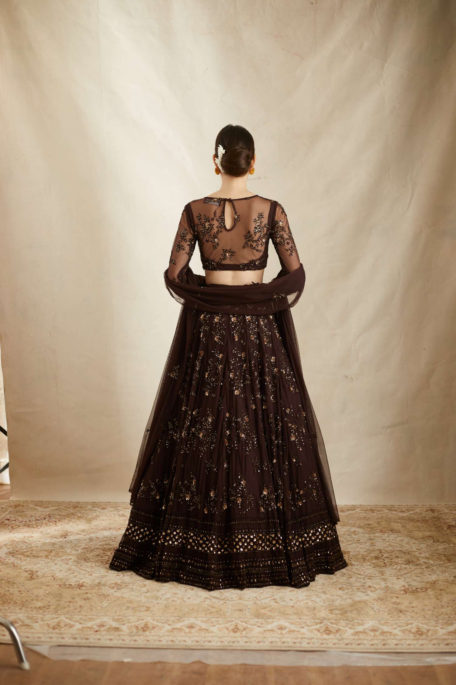 Back angle view of Dark Coffee Net Thread Embroidered Lehenga Set