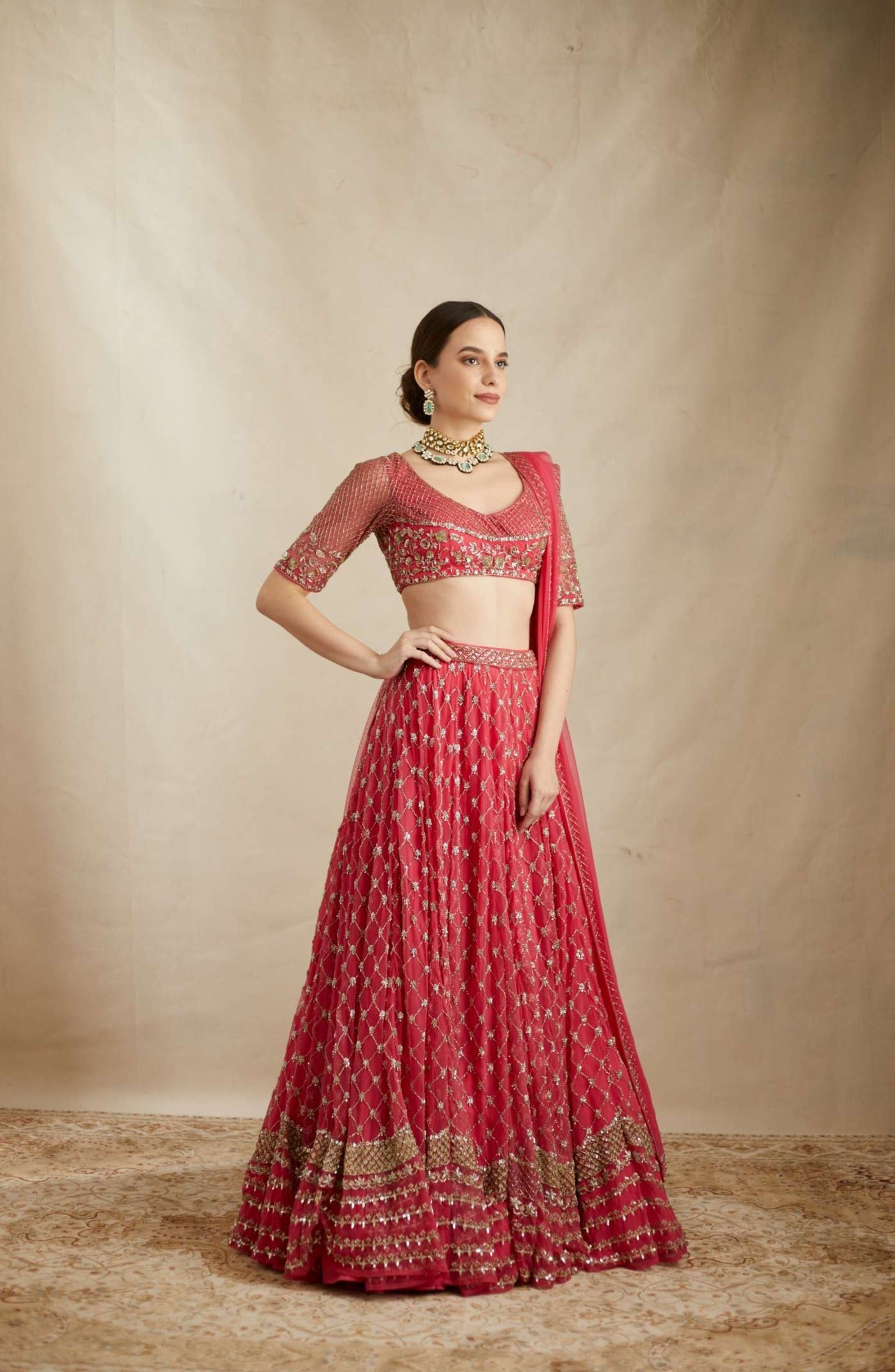 Side view of Caramine Pink Heavy Jaal Work Lehenga Set