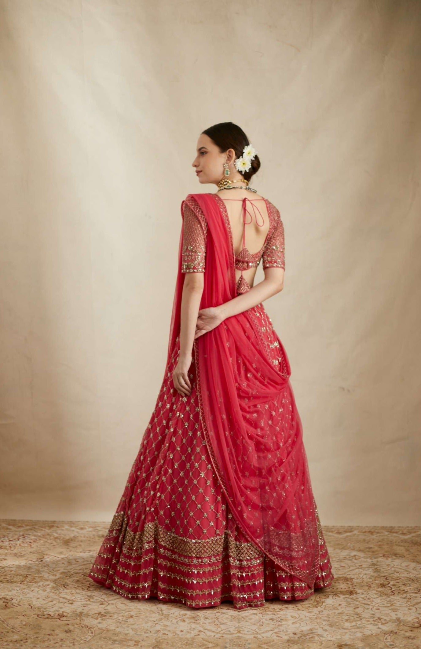 Side view of Caramine Pink Heavy Jaal Work Lehenga Set