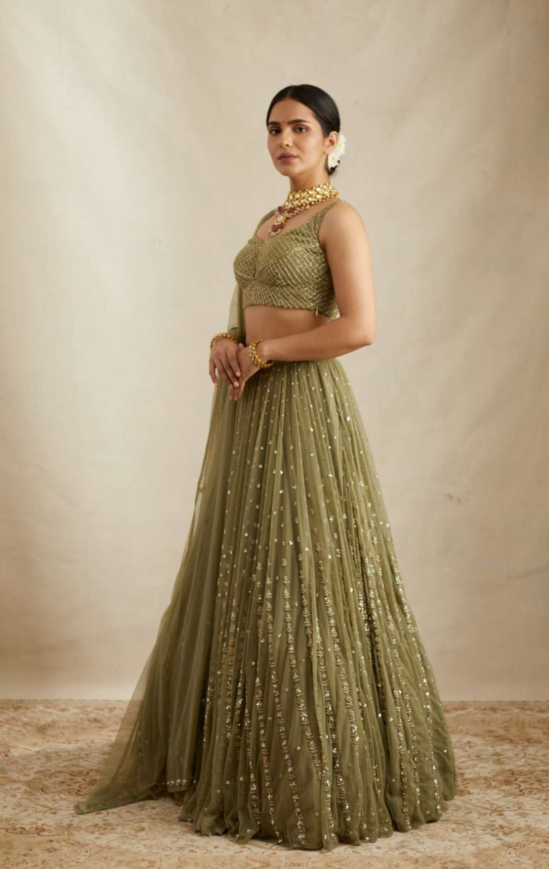 Side Front view of Olive Green Net Crepe Line Embroidered Lehenga Set