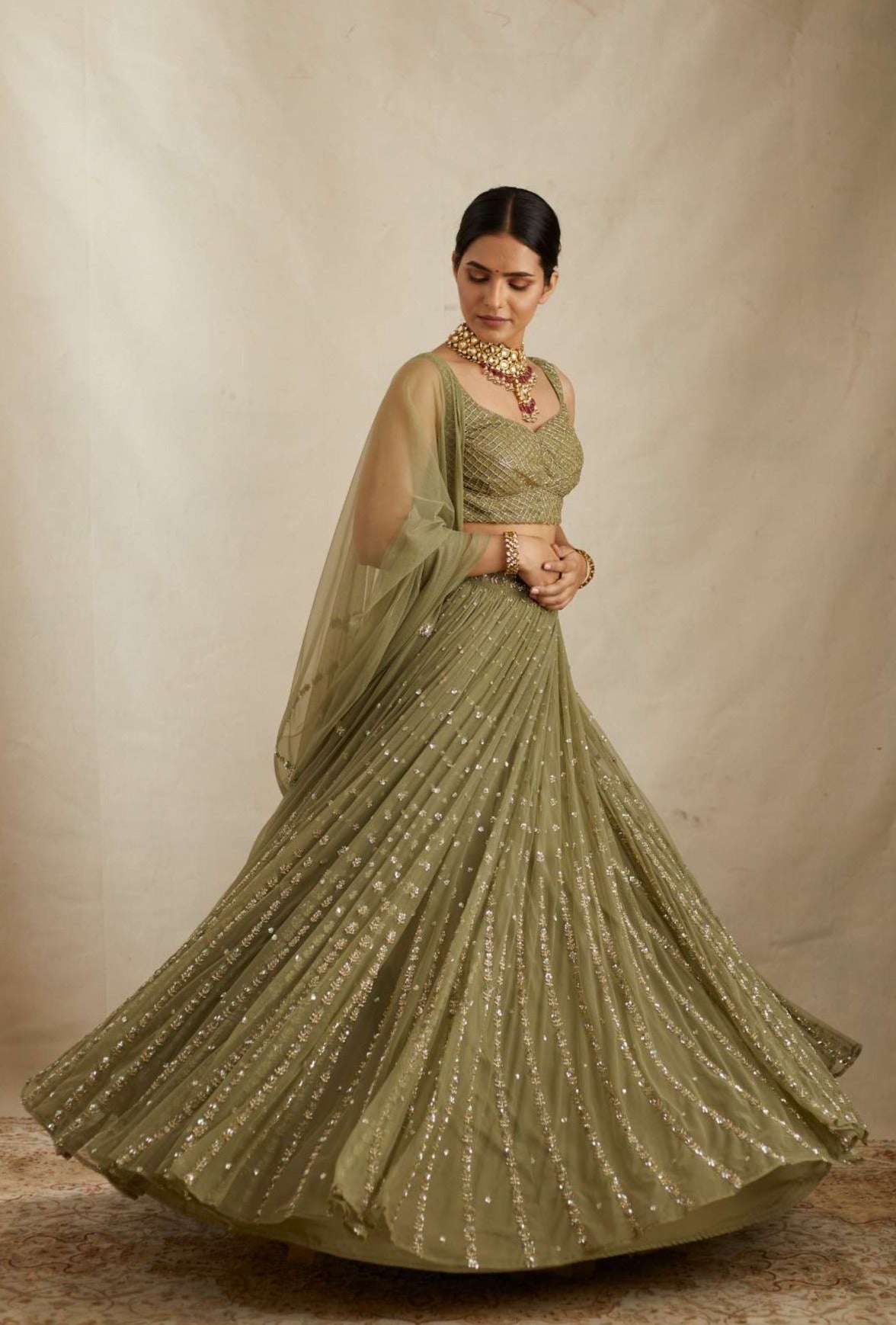 Side view of Olive Green Net Crepe Line Embroidered Lehenga Set
