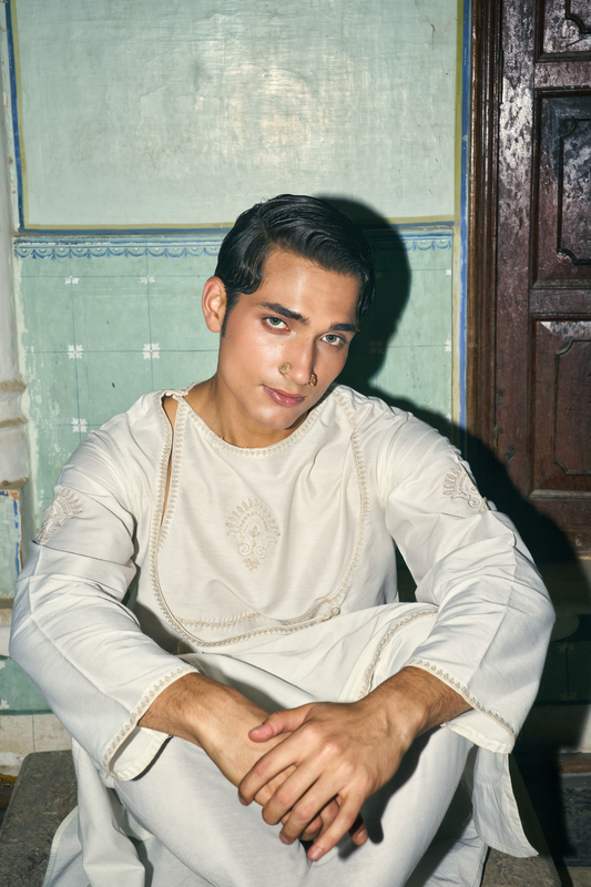 Ivory cotton-silk angrakha paired with a churidar salwar