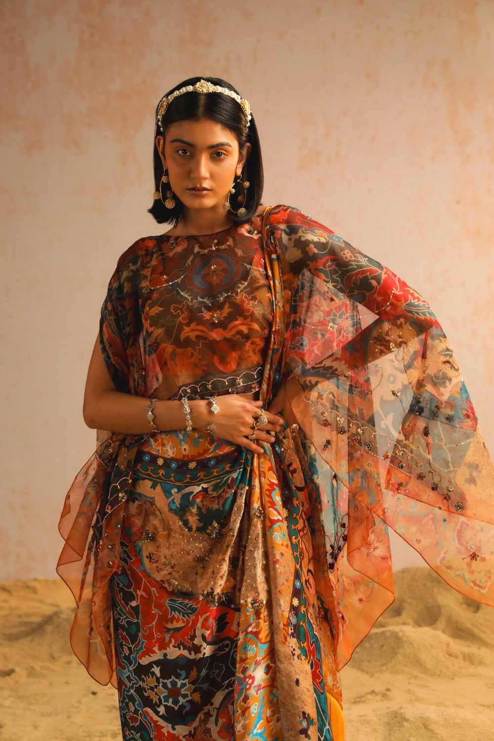 Mustard yellow draped saree with blouse and cape
