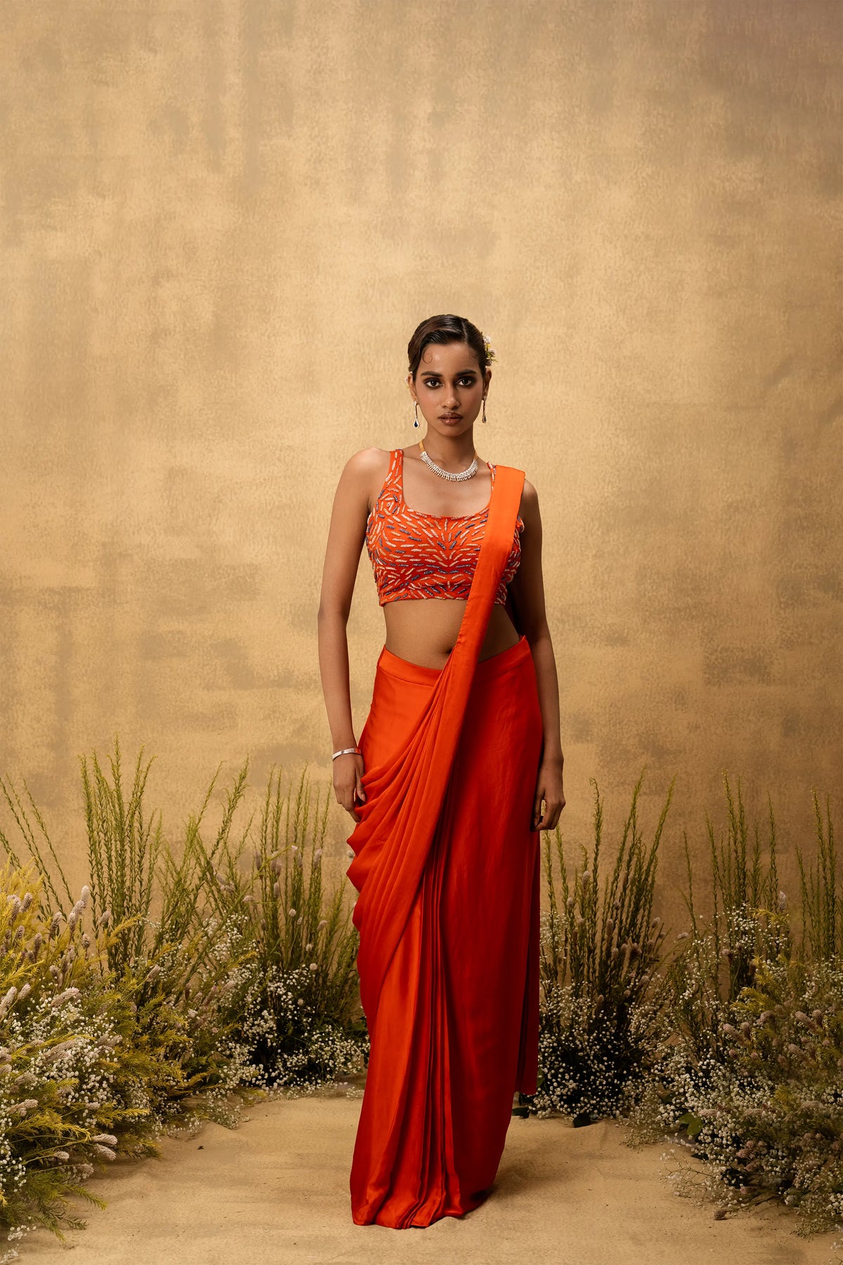 Bright Orange pre-draped modal satin saree with embroidered blouse