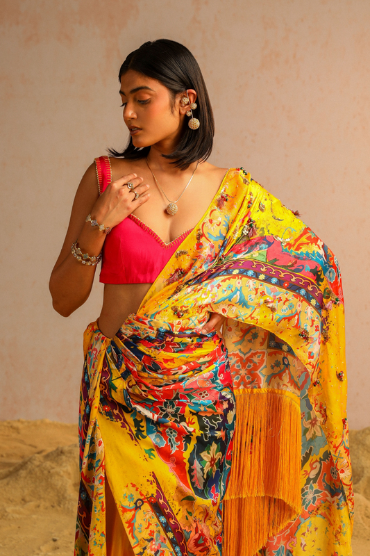 Yellow draped saree with hot pink blouse