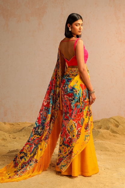 Yellow draped saree with hot pink blouse