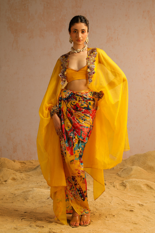 Yellow draped skirt with blouse and cape