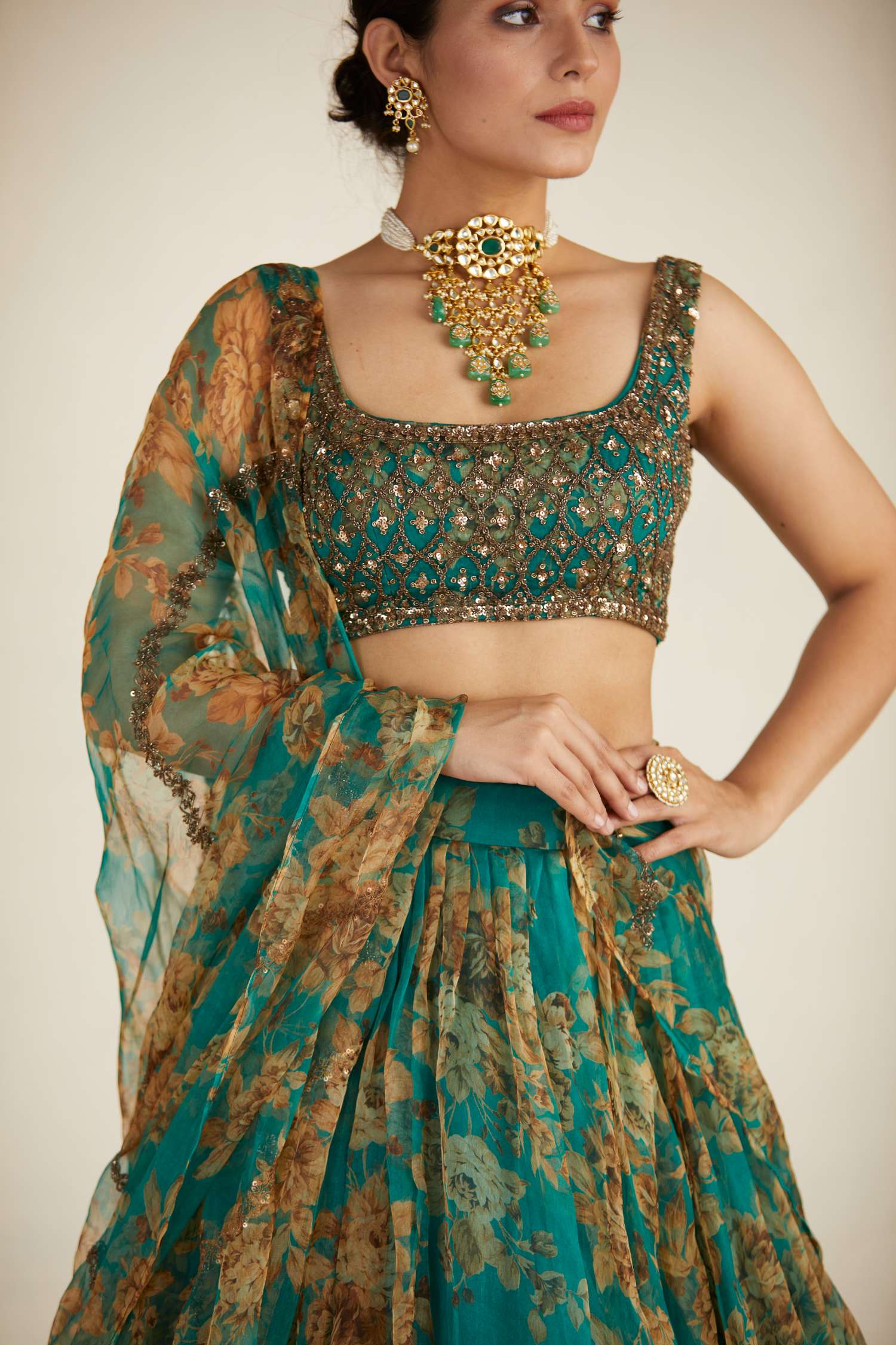 Close-up of Teal Green Floral Organza Lehenga Set
