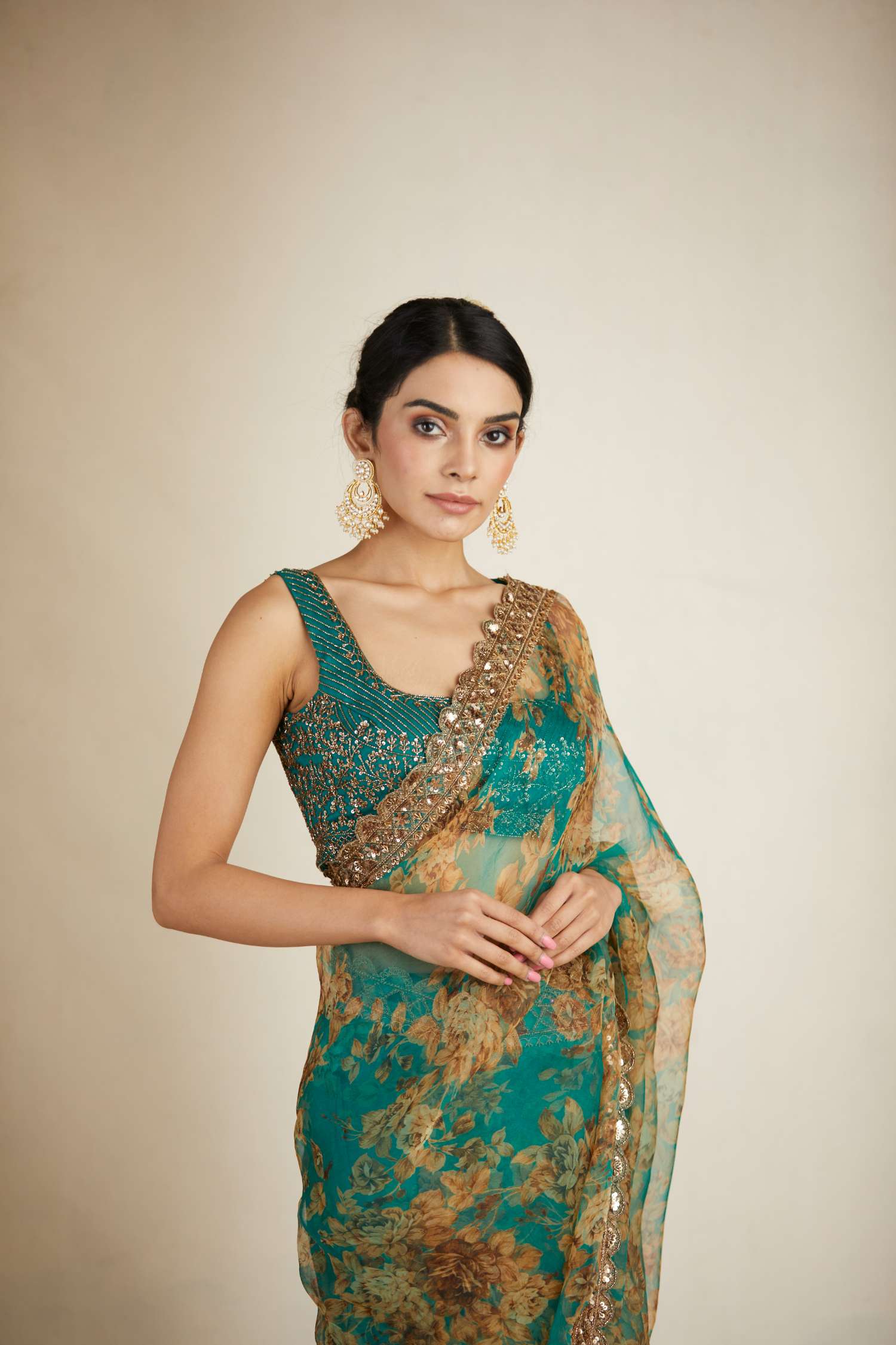 Close-up View of Teal Green Floral Organza Saree