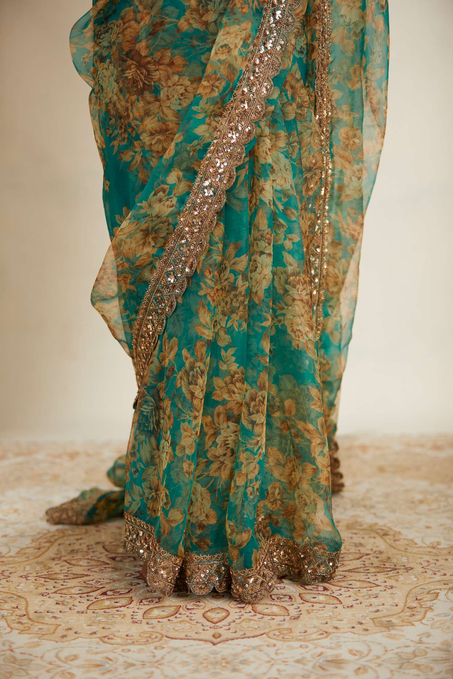 Close-up of Teal Green Floral Organza Saree Set