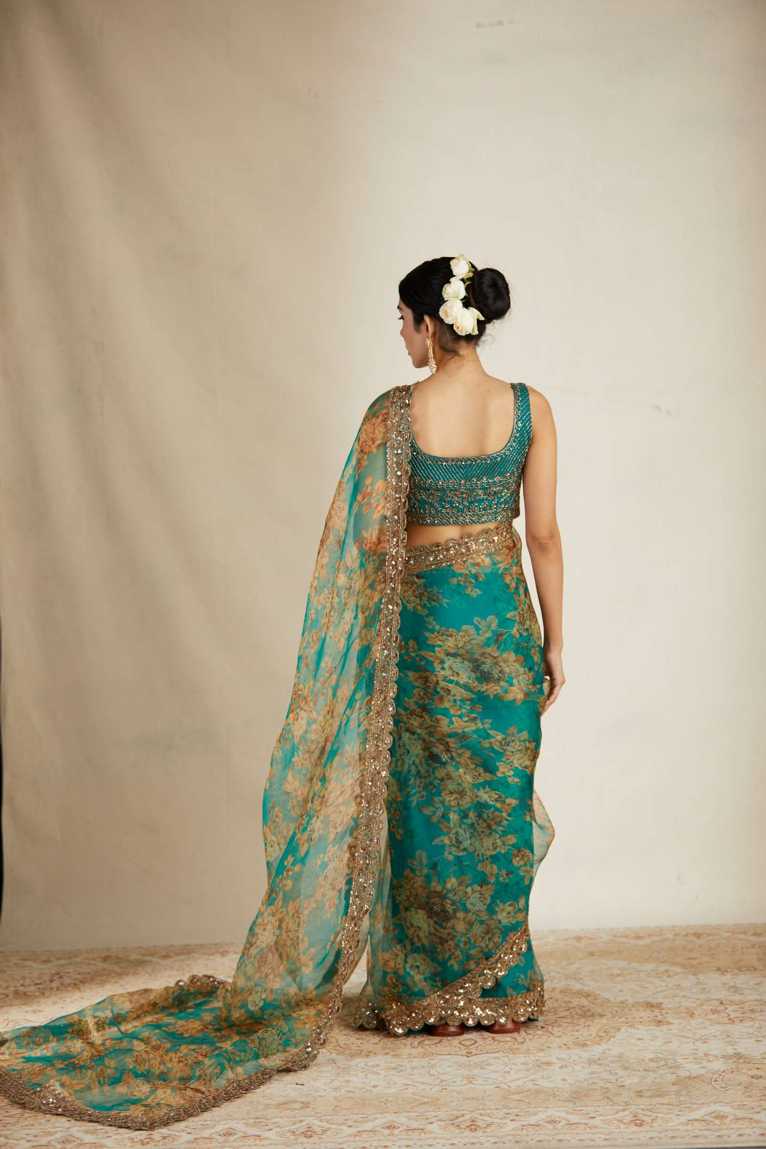 Back Angle view of Teal Green Floral Organza Saree Set